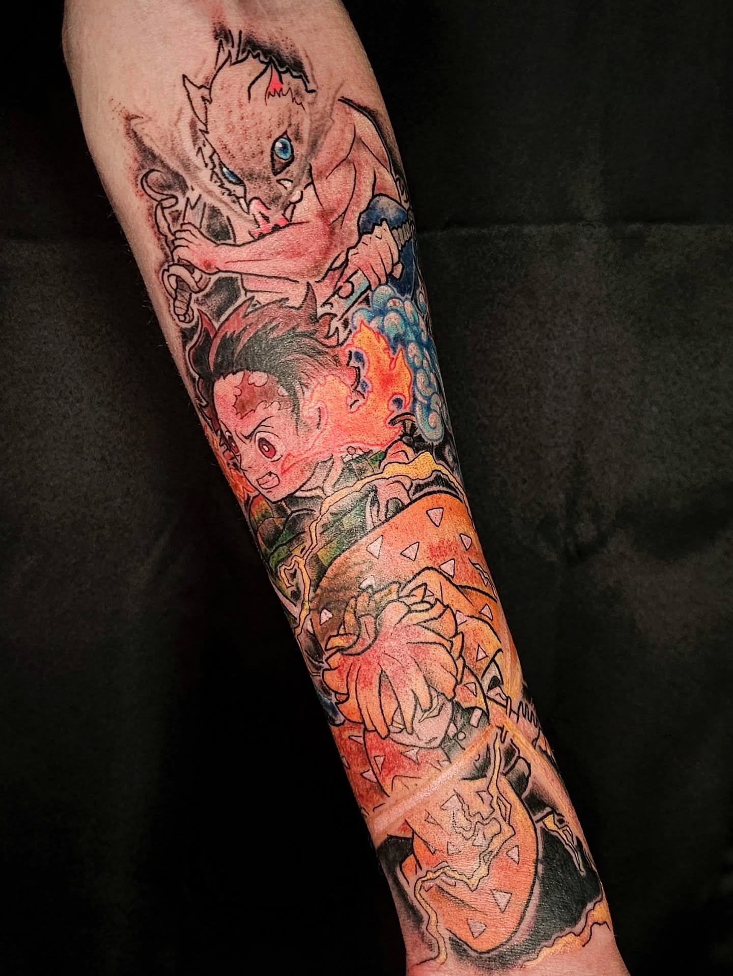 Dragon and warrior anime tattoo on the forearm by Damian Eames