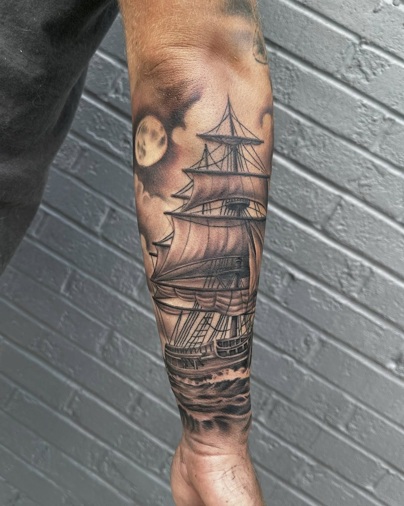 Sailboat black and grey tattoo on the forearm by Corey Bailey, Stanton, Kentucky