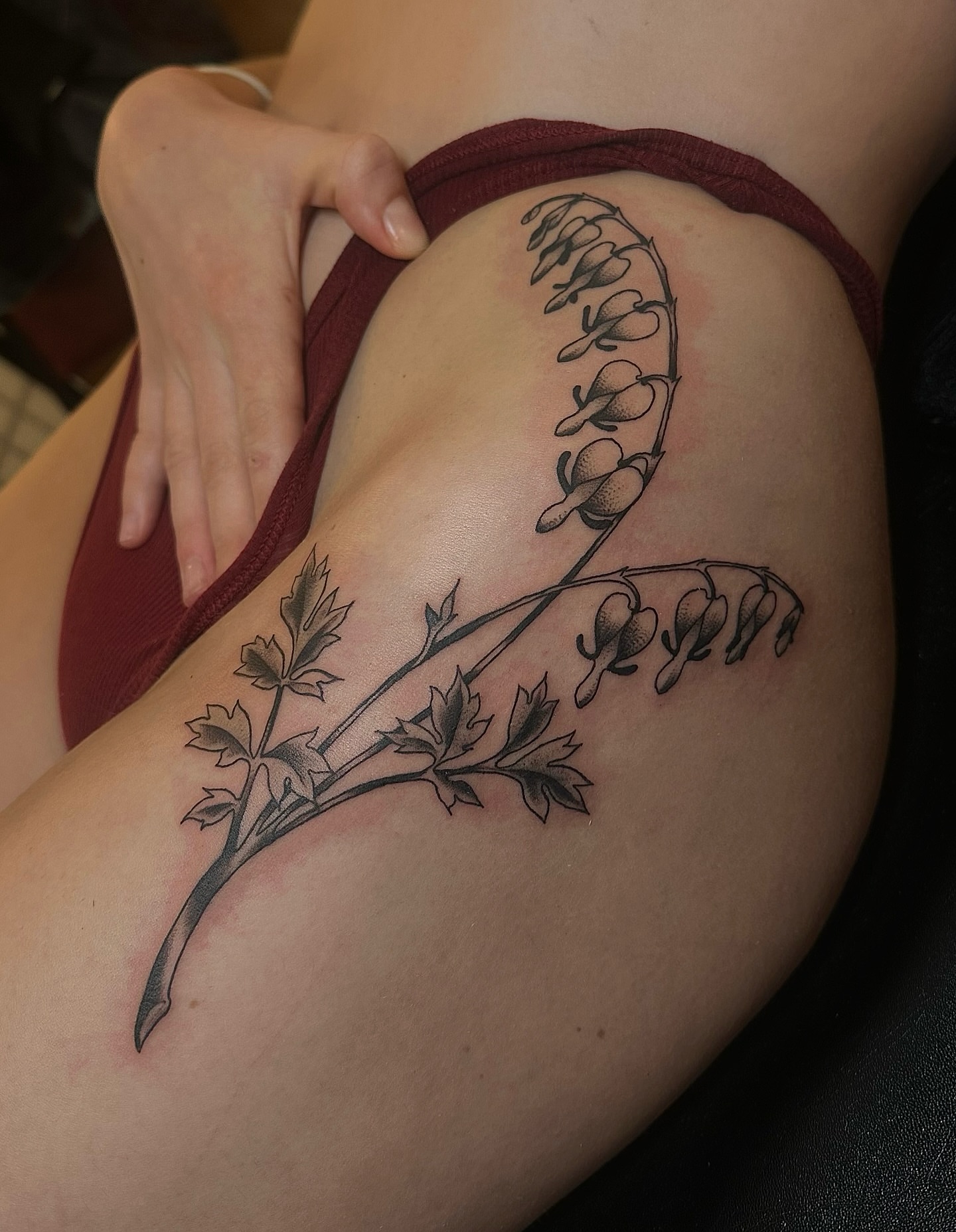 Flower vine black and grey tattoo on the thigh by Sequoia Rose, Portland, Oregon