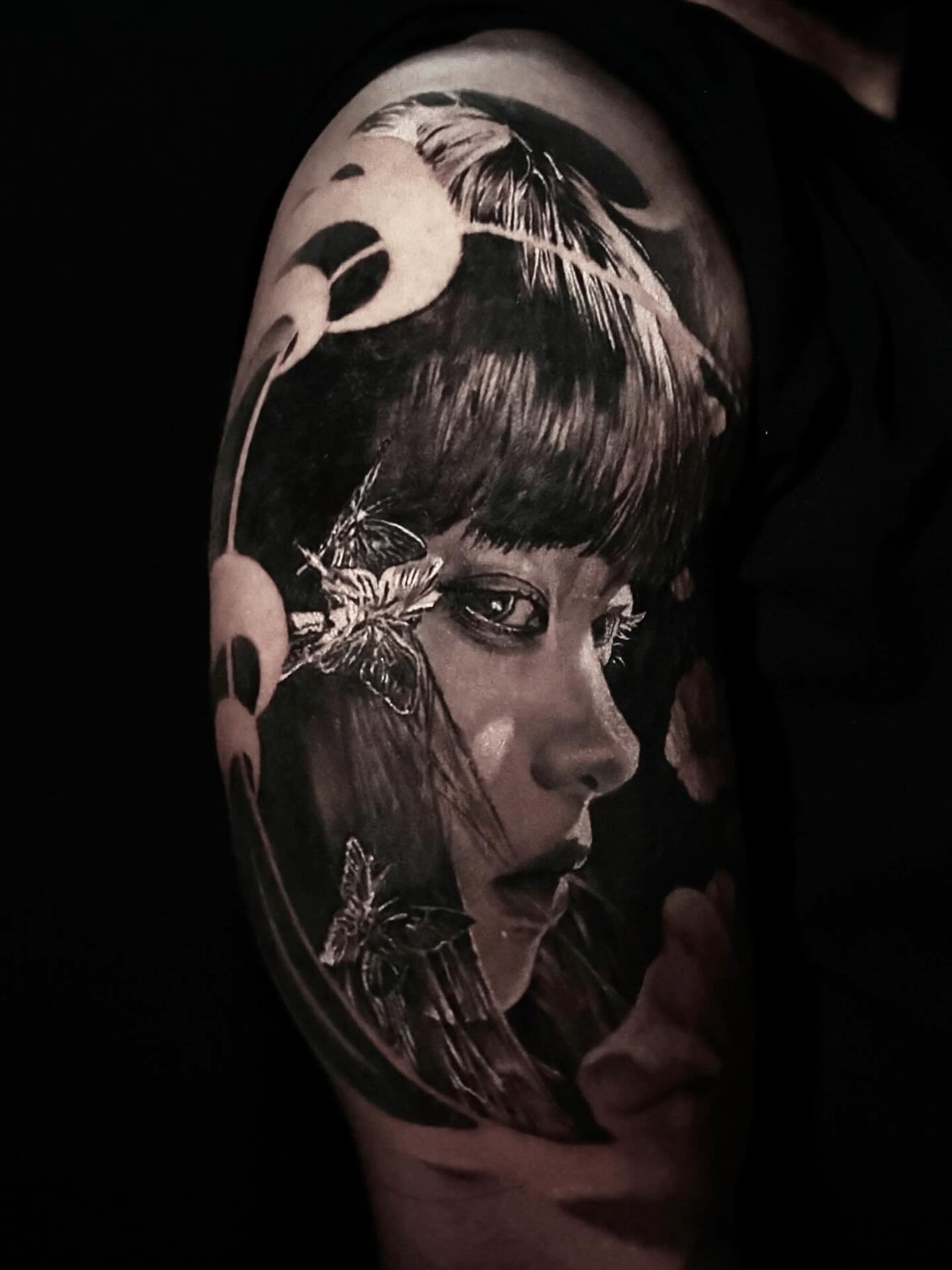 Woman's face realism tattoo on the shoulder by Yu Chen