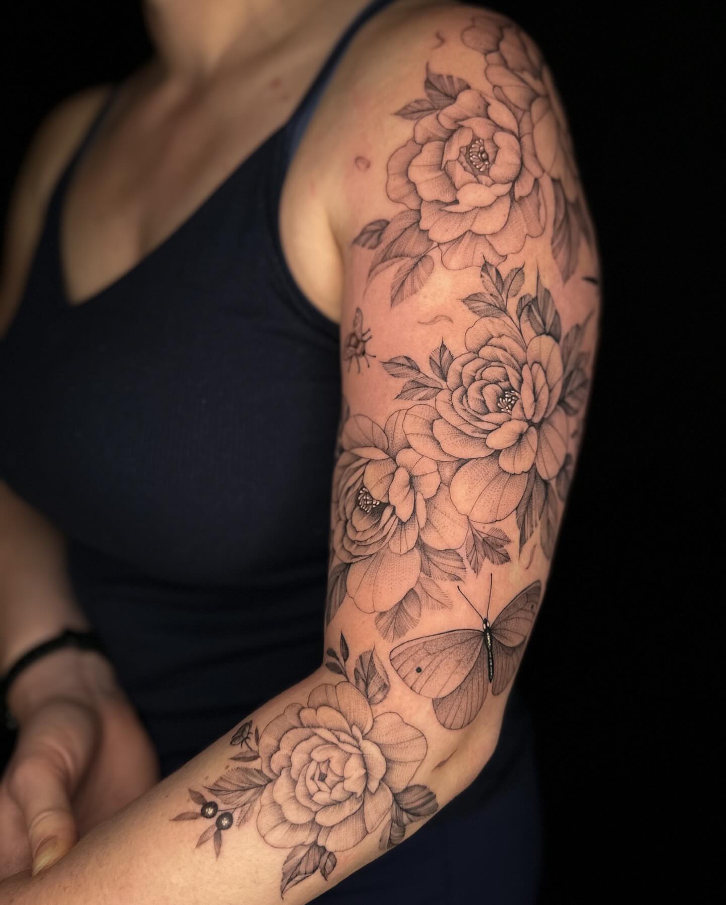 Floral bouquet realism tattoo on the forearm by Jhonny David lay