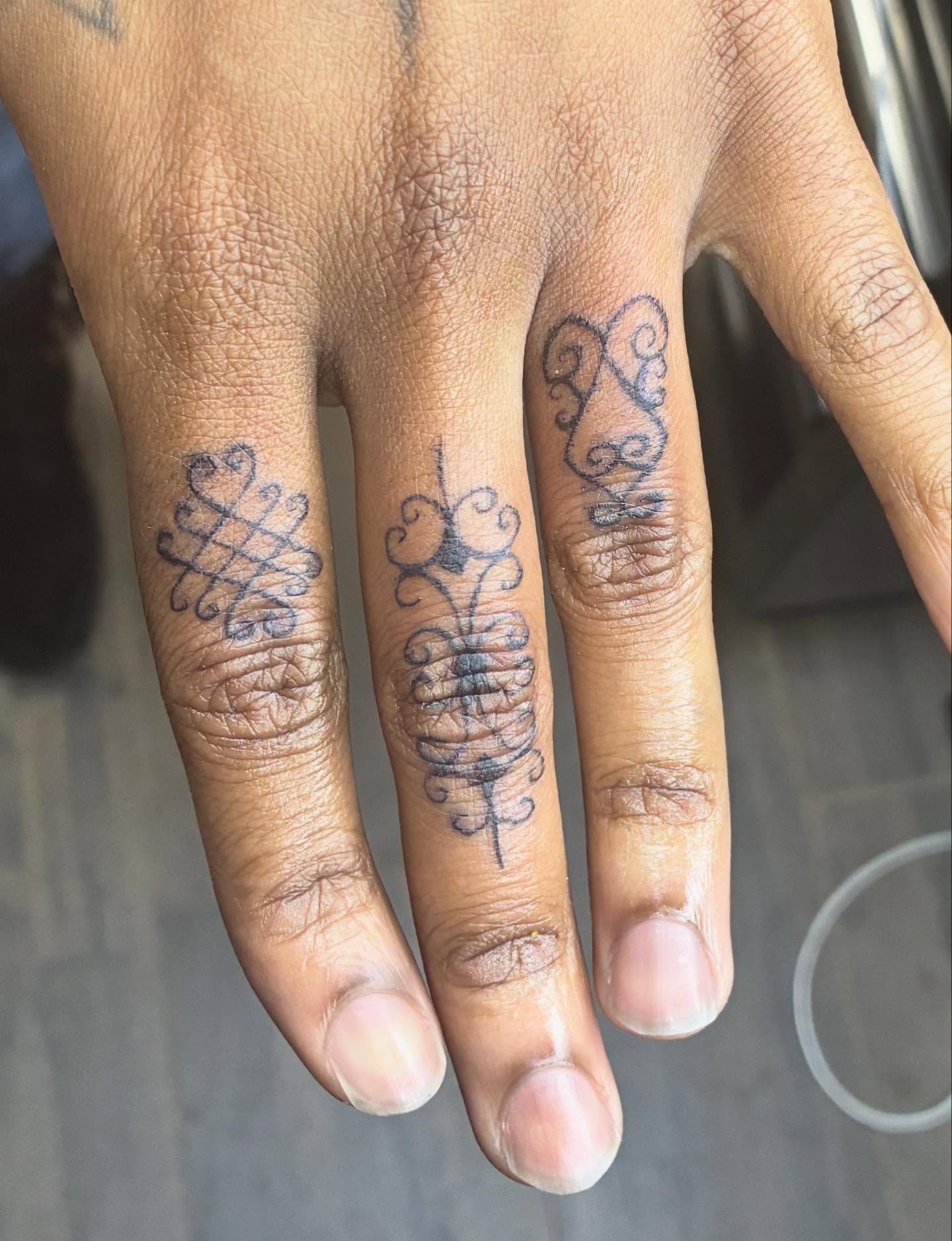 Scrollwork ornamental tattoo on the hand by Mickey