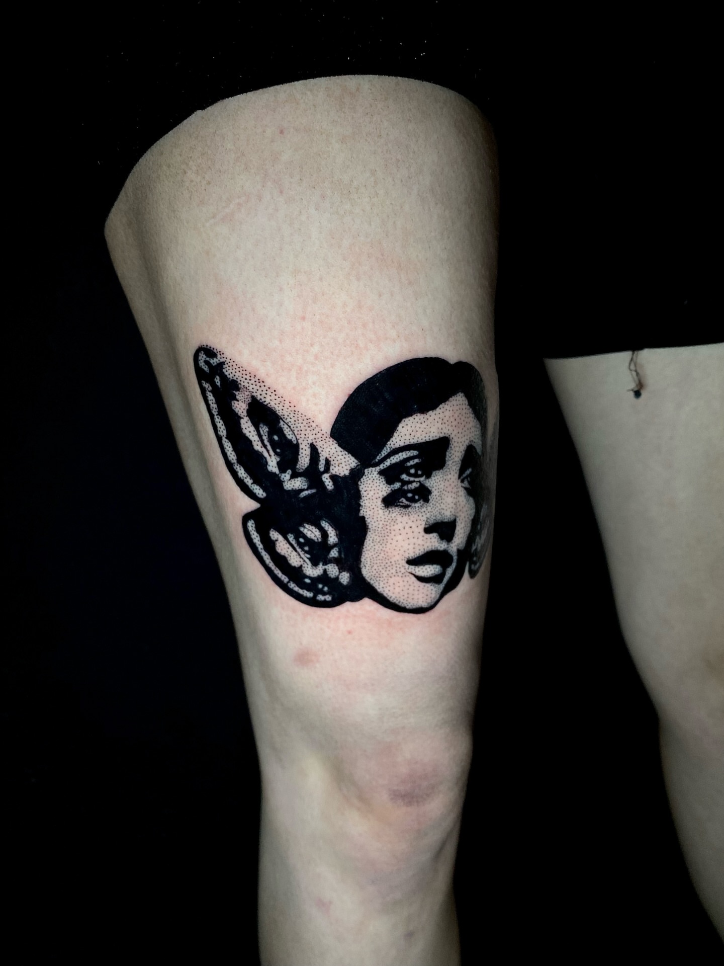 Woman's face with wings dotwork tattoo on the forearm by Cherry Jane 🍒