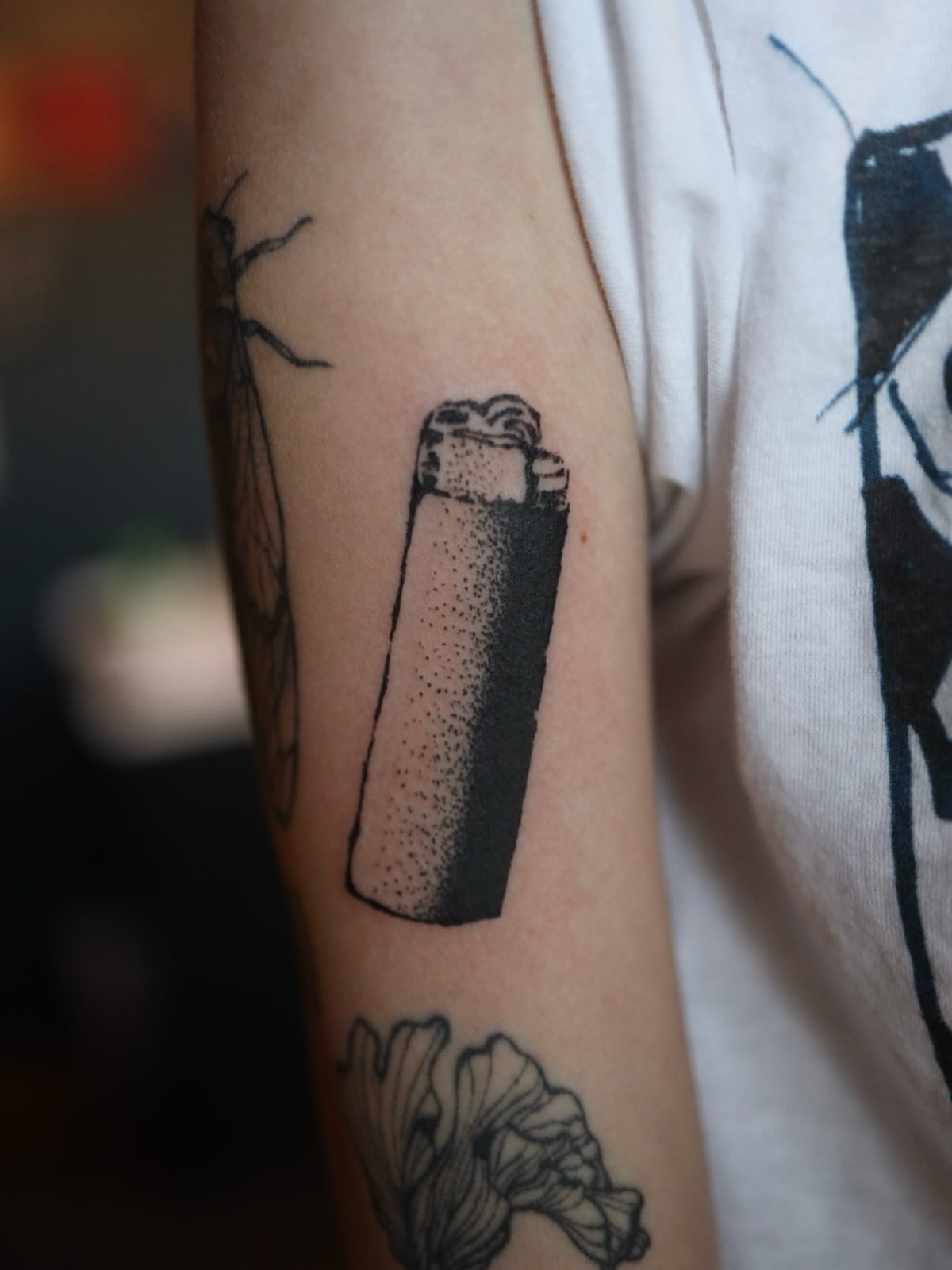 Lighter dotwork tattoo on the forearm by morgan purcey