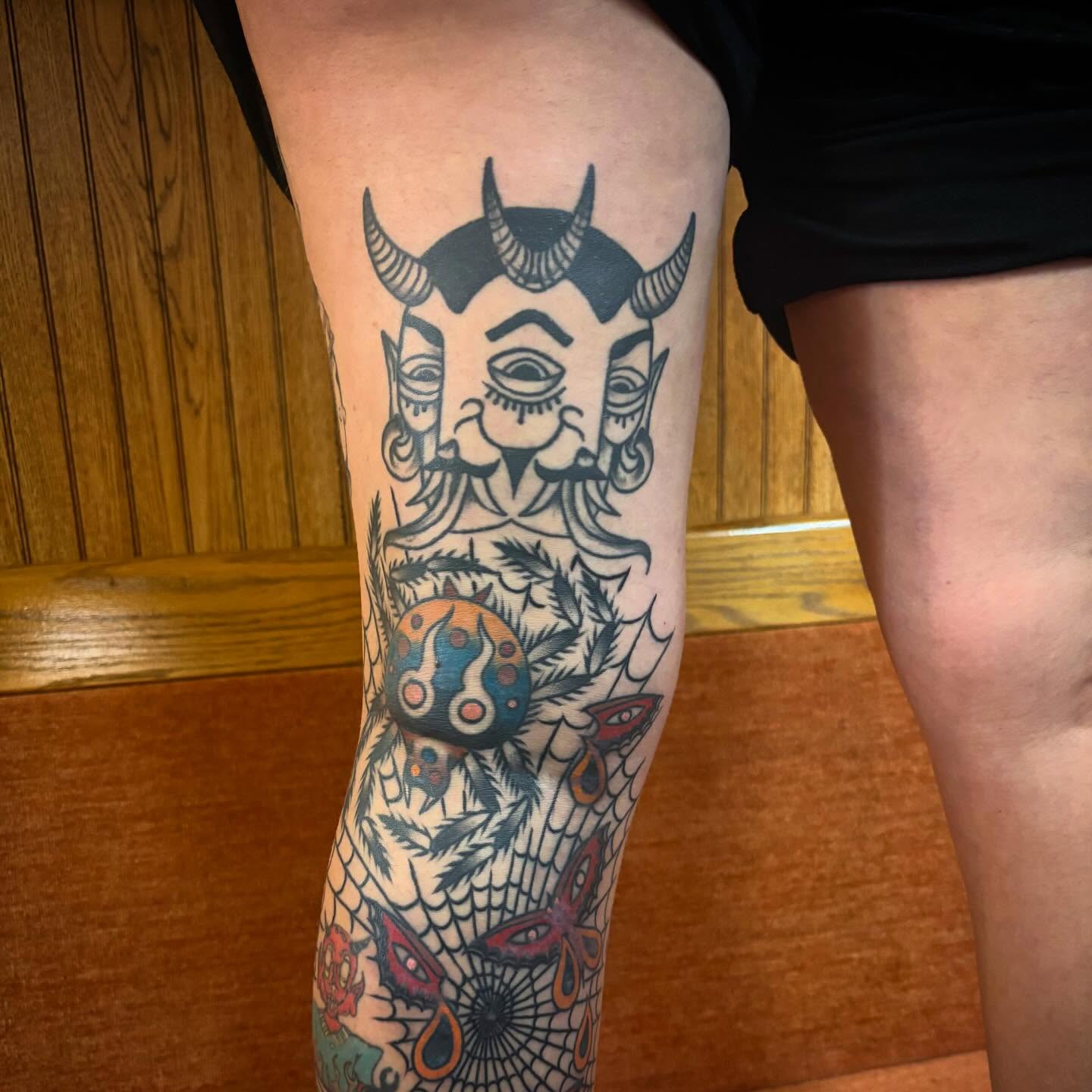 Demon mask American traditional tattoo on the forearm by Lauren Deets