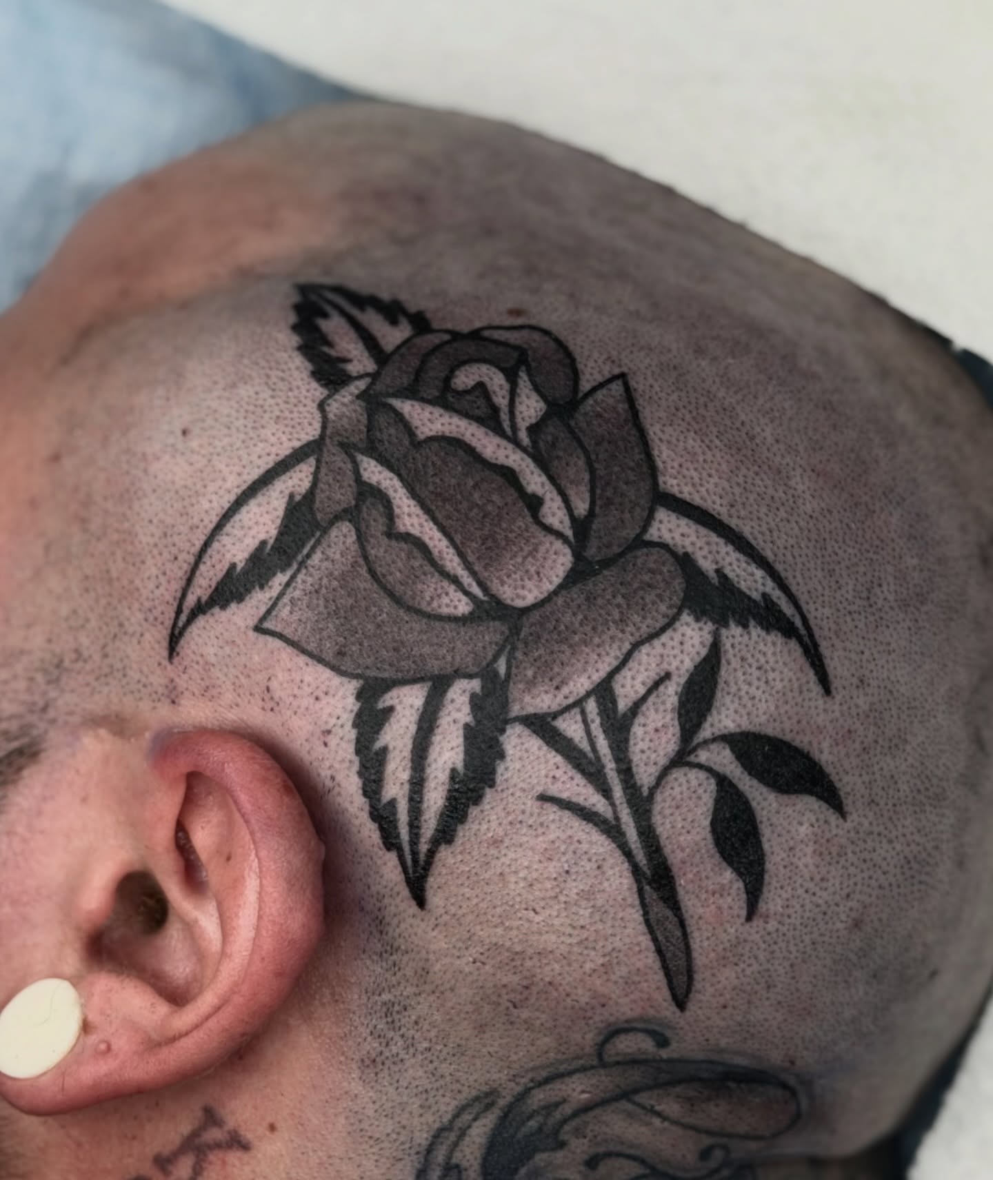 Rose dotwork tattoo on the head by Maks