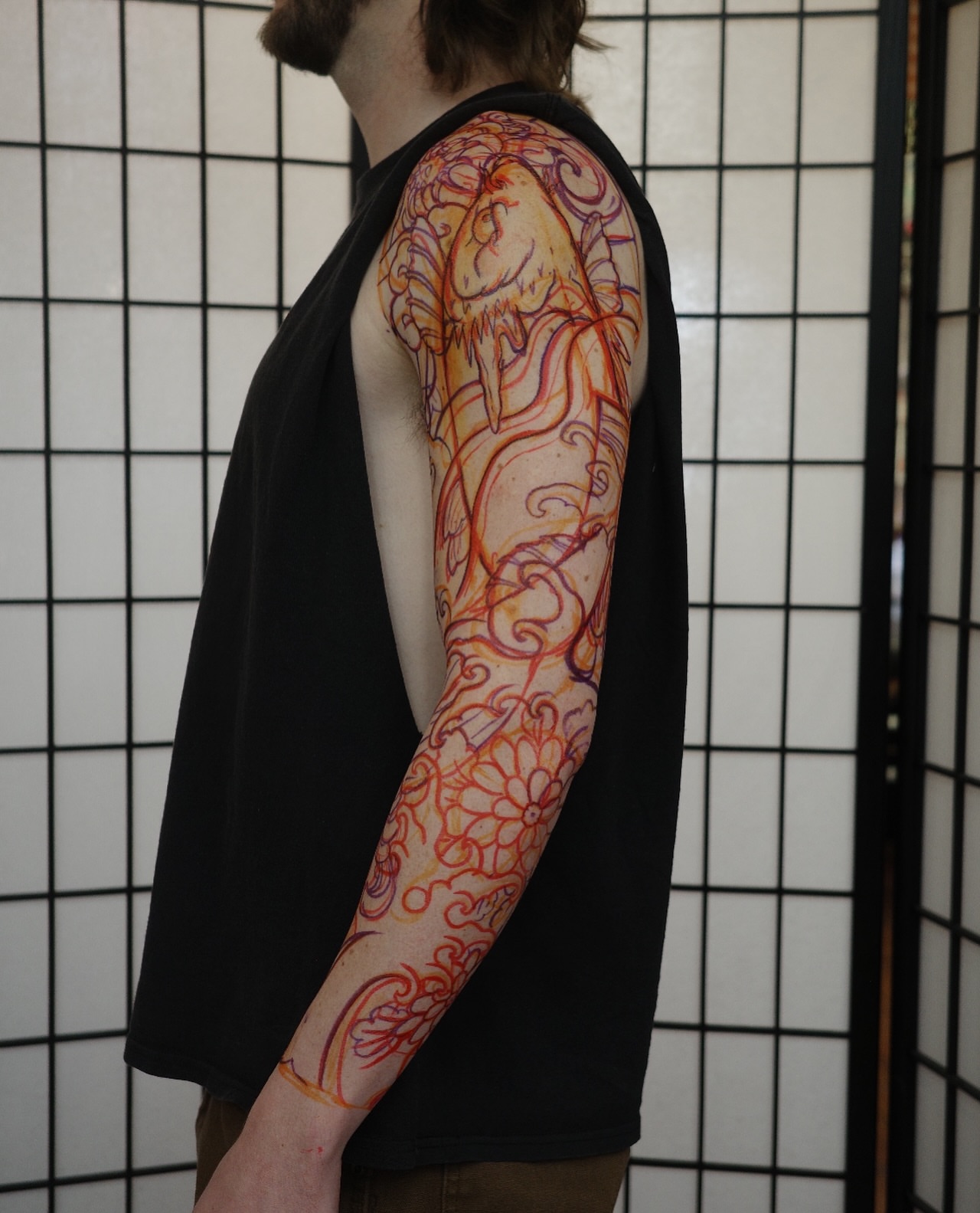 Floral design new school tattoo on the upper arm by Innokenty Meshchakov, Portland, Oregon