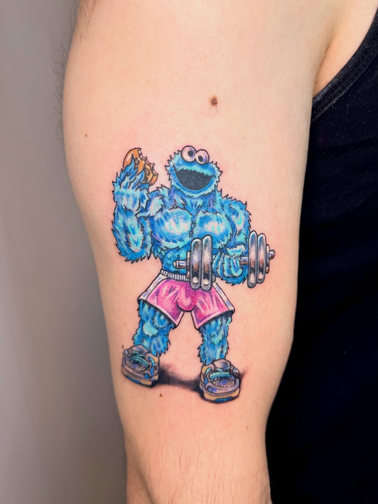 Cookie Monster lifting weights realism tattoo on the thigh by Franky A Bonifacio, Seattle, Washington