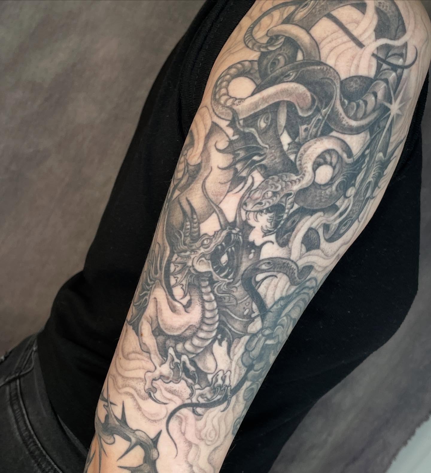 Serpent and dragon japanese irezumi tattoo on the forearm by 𝖂𝖍𝖆𝖙𝕽𝖊𝖎𝖑𝖊𝖞