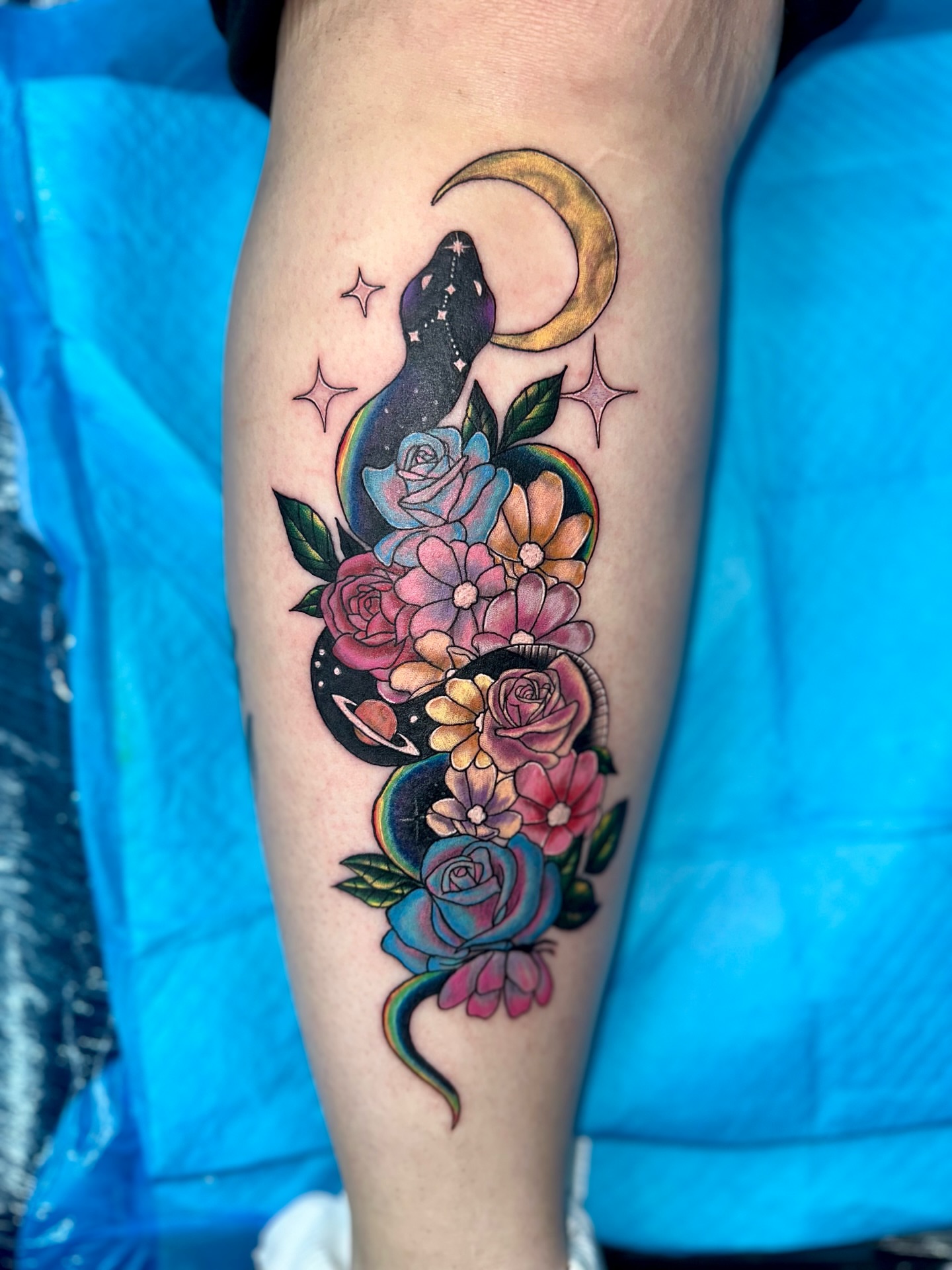 Snake and flowers new school tattoo on the forearm by Sk Pierce