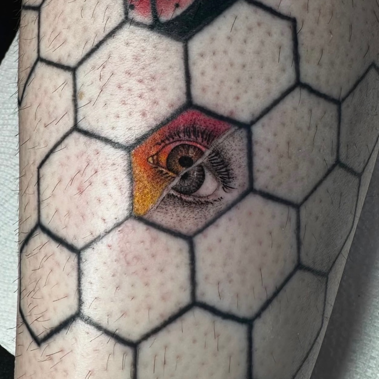Eye geometric tattoo on the forearm by Angel Tattoos
