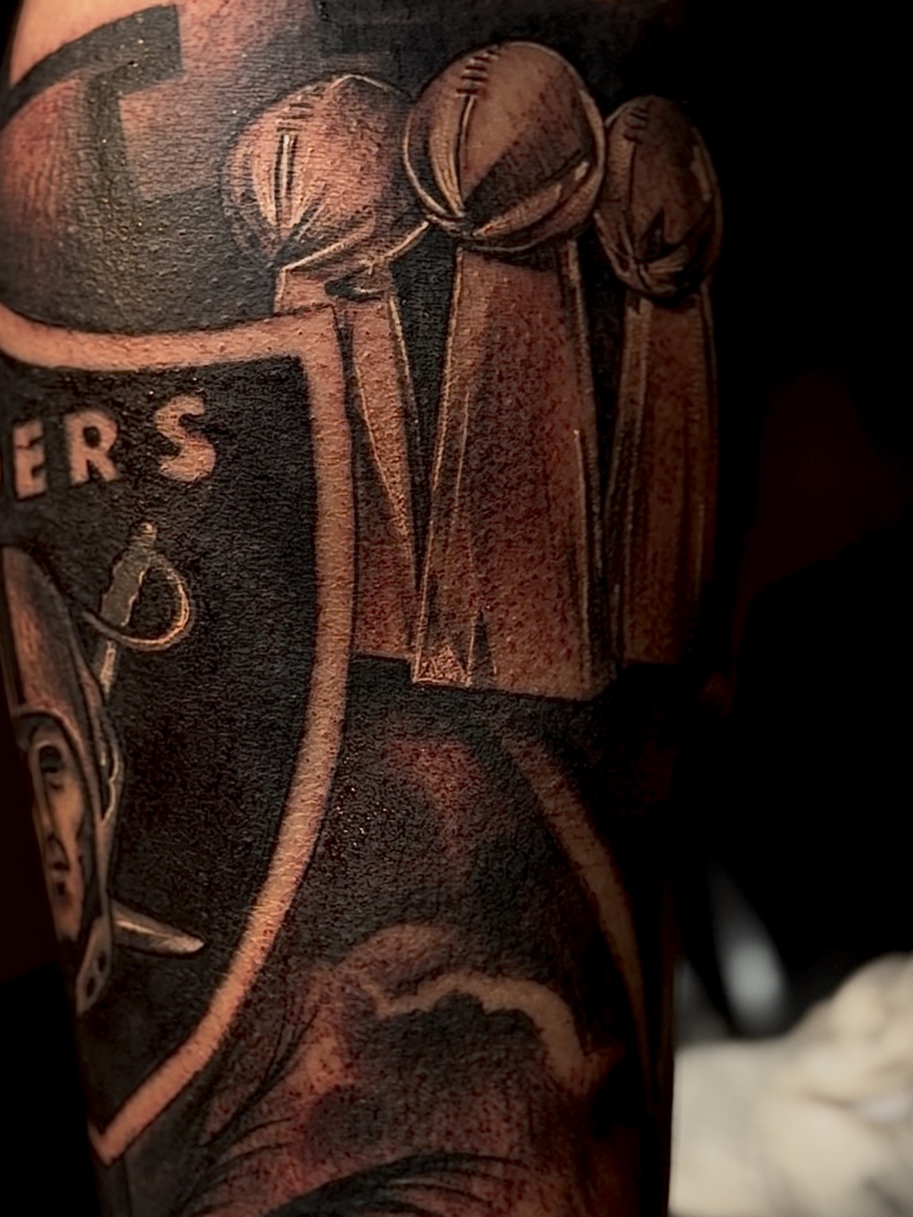 Football trophies American traditional tattoo on the forearm by Raul Rodriguez