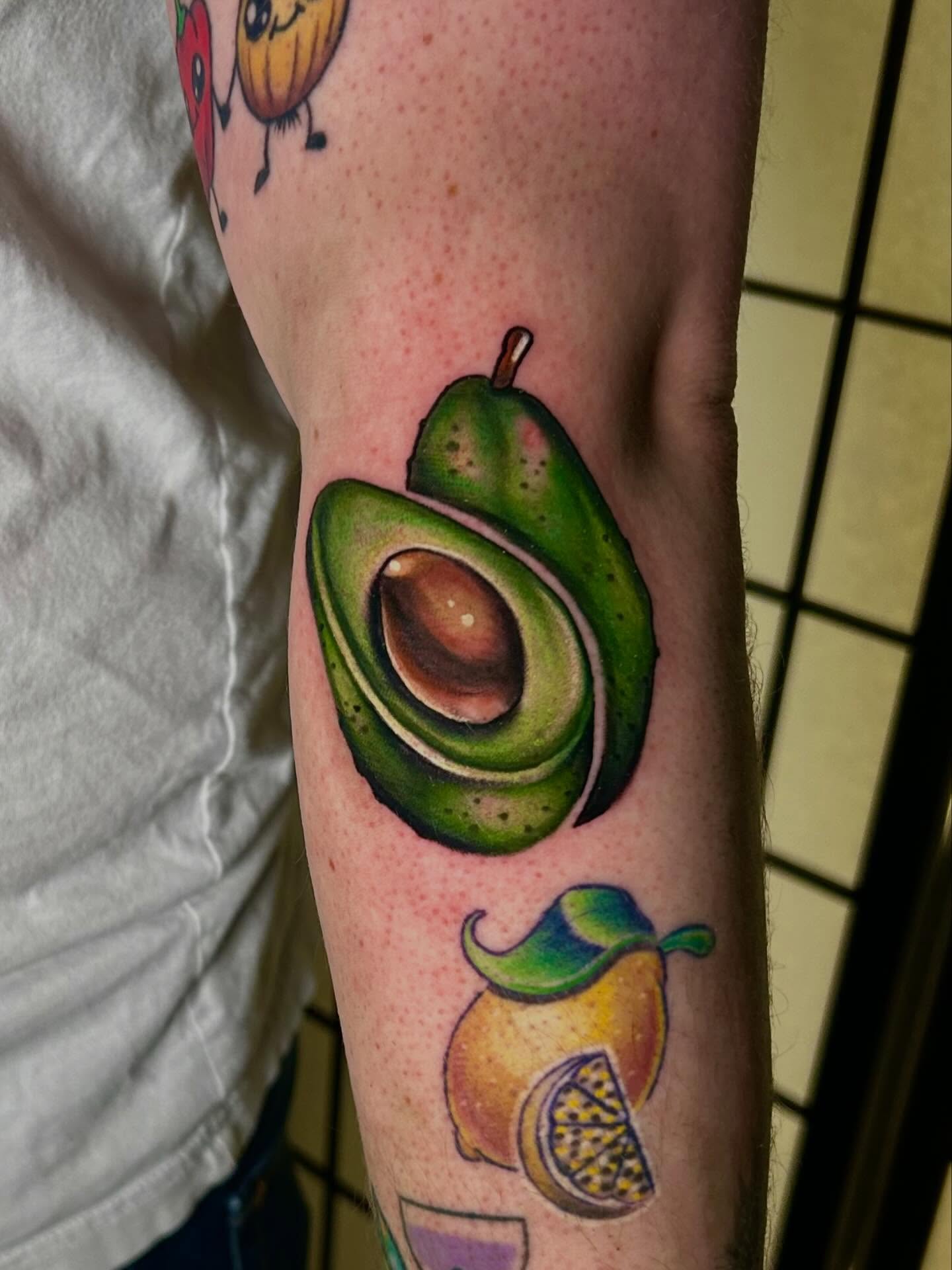 Avocado realism tattoo on the forearm by Haleigh Cunningham, Charlotte, North Carolina
