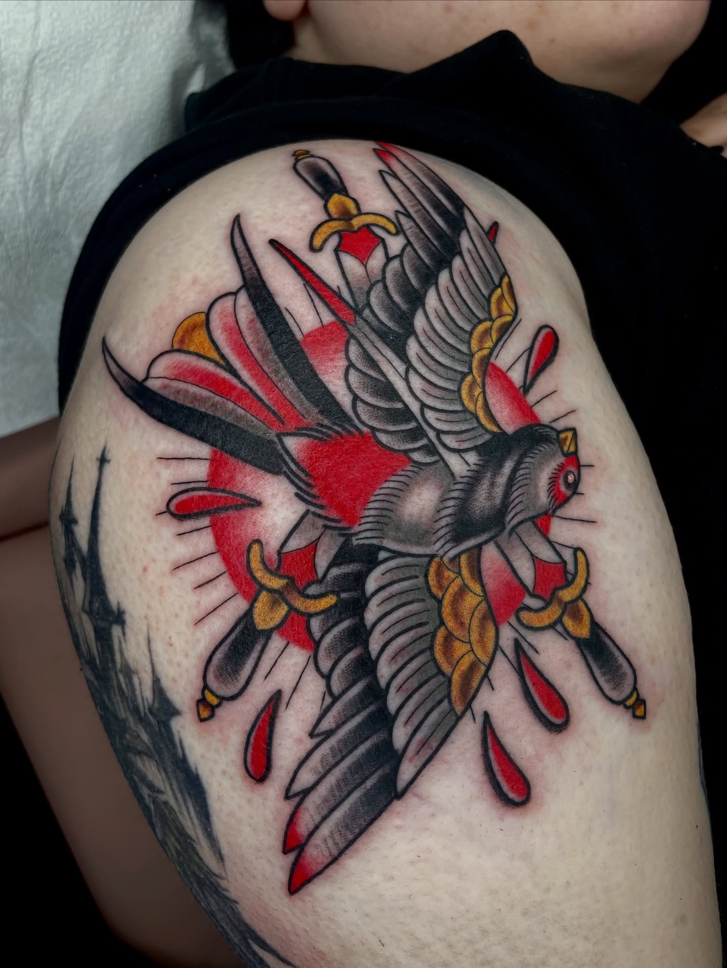 Eagle with swords American traditional tattoo on the shoulder by Josh Johns