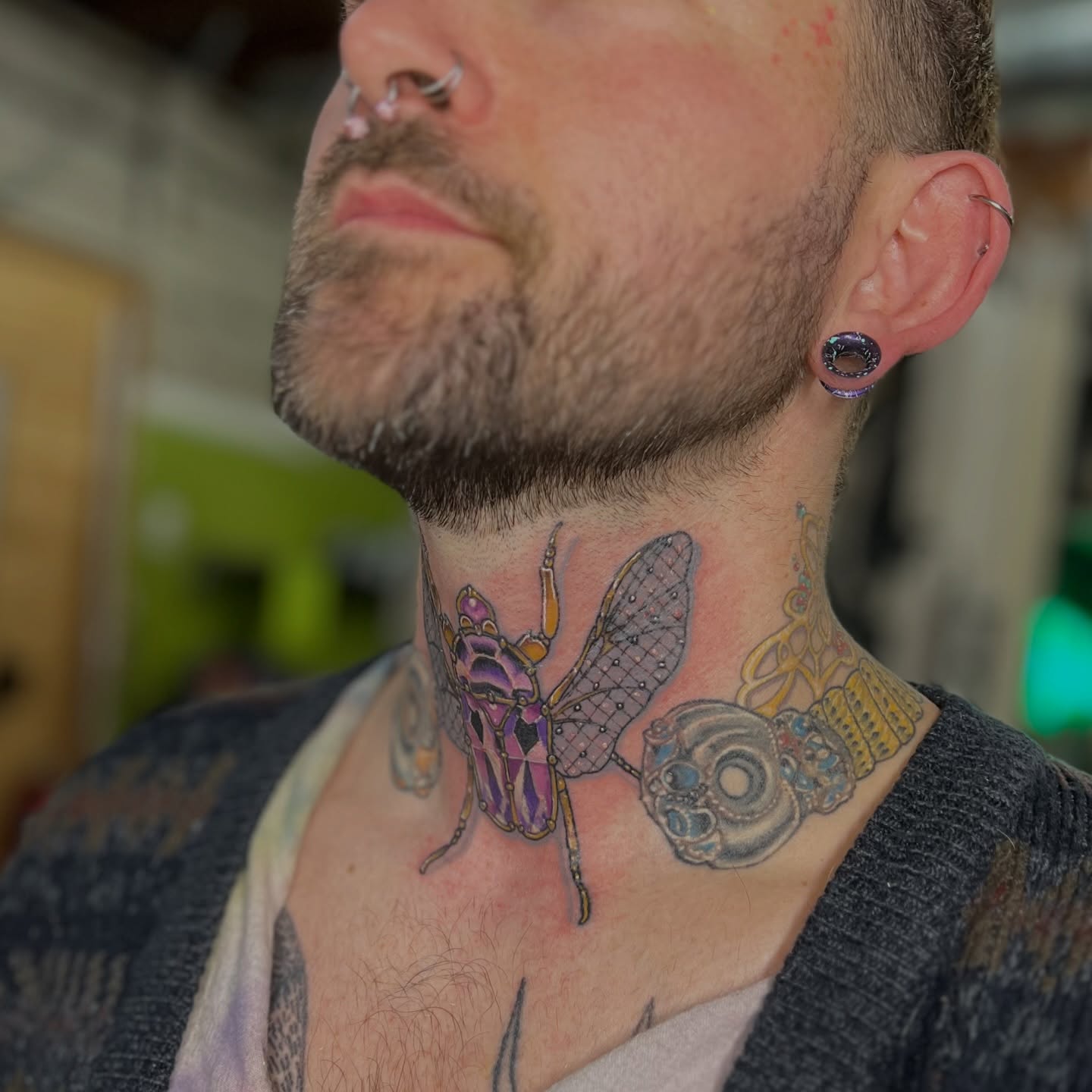 Insect geometric tattoo on the neck by Alex Santaloci