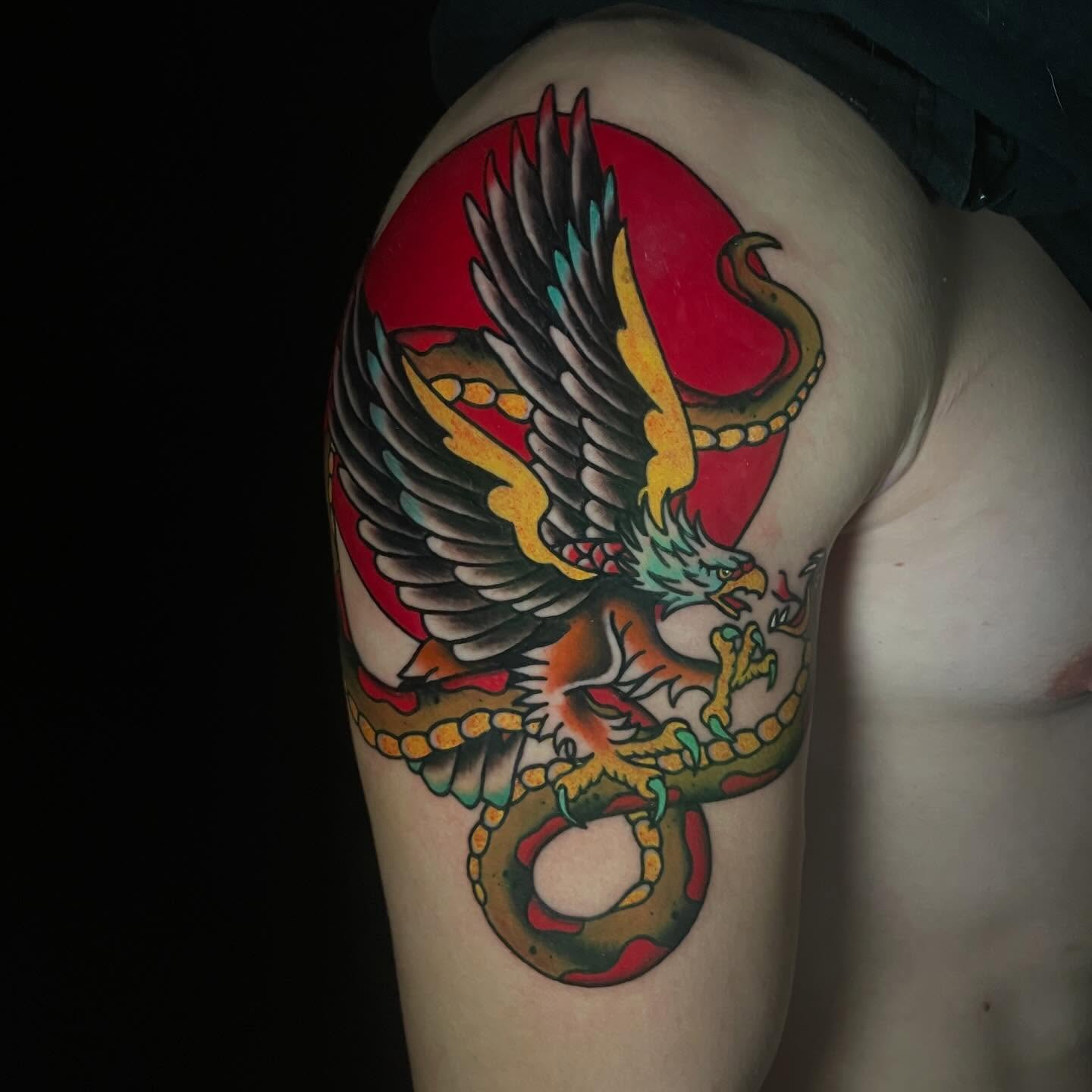 Eagle and snake American traditional tattoo on the shoulder by Alexis Skye