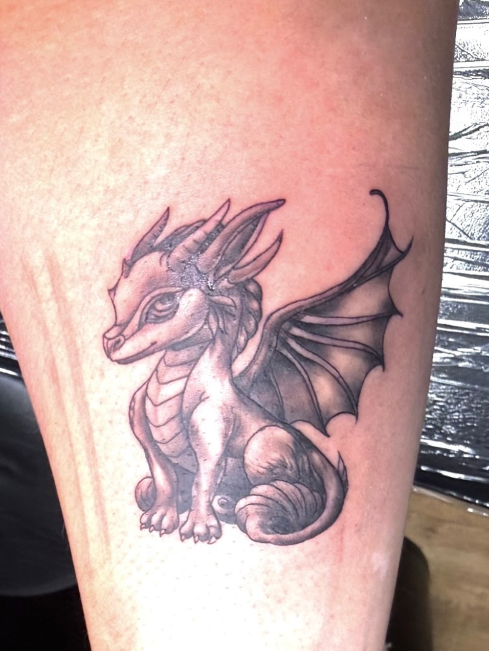 Dragon black and grey tattoo on the thigh by Tattoos by Robyn Pallotta, Austin, Texas