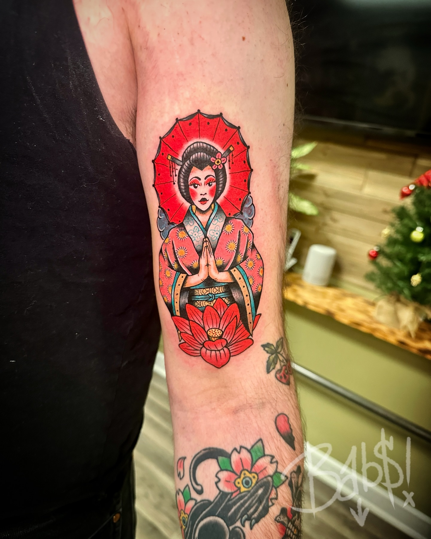 Geisha American traditional tattoo on the forearm by Justin B