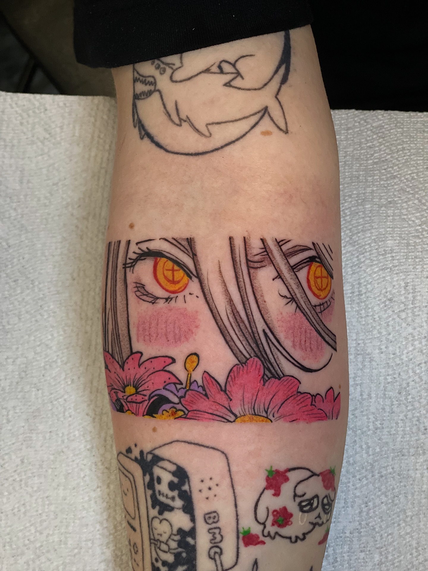Anime girl with flowers anime tattoo on the forearm by Seth Mullin, Hemet, California