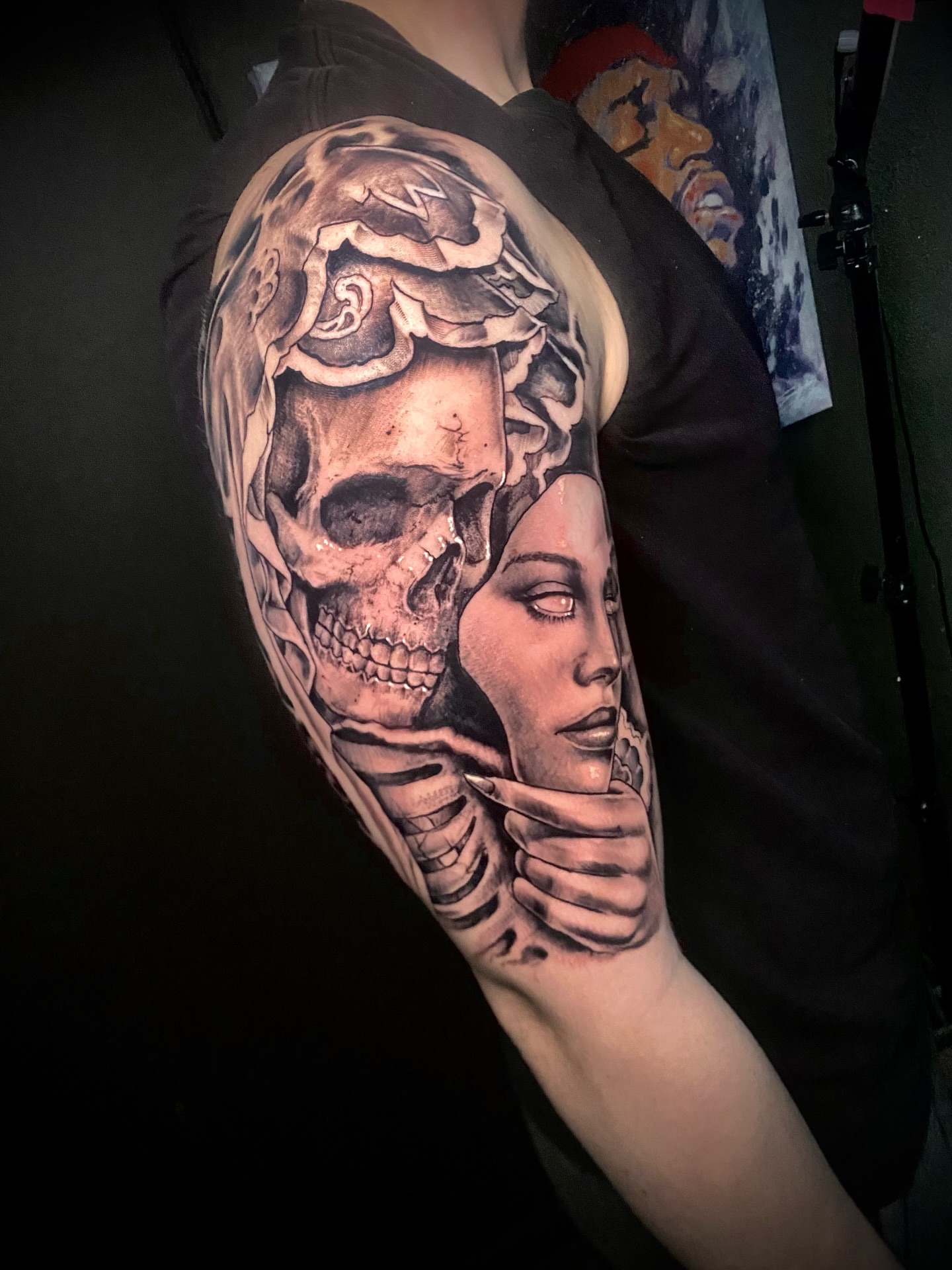 Skull and woman realism tattoo on the forearm by Adam Newton