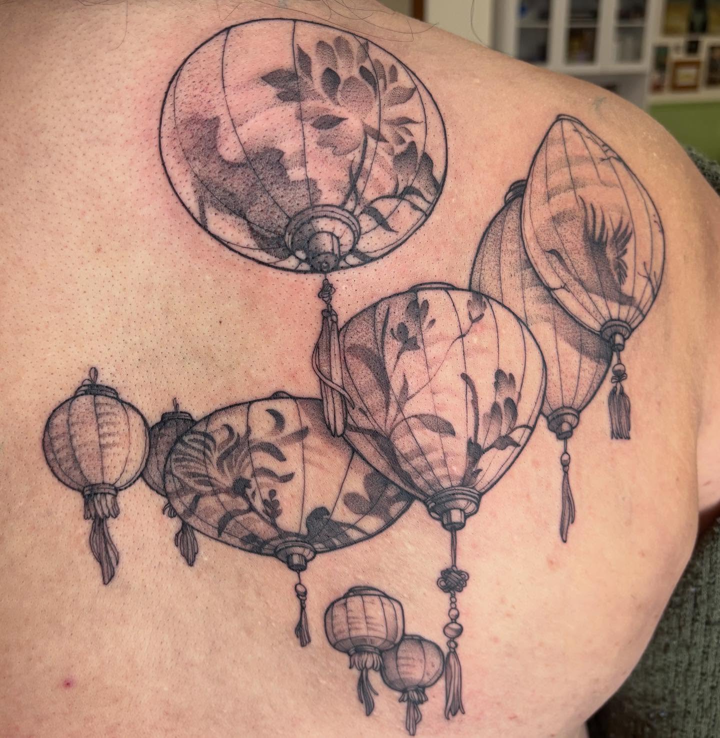 Lanterns dotwork tattoo on the shoulder by joely