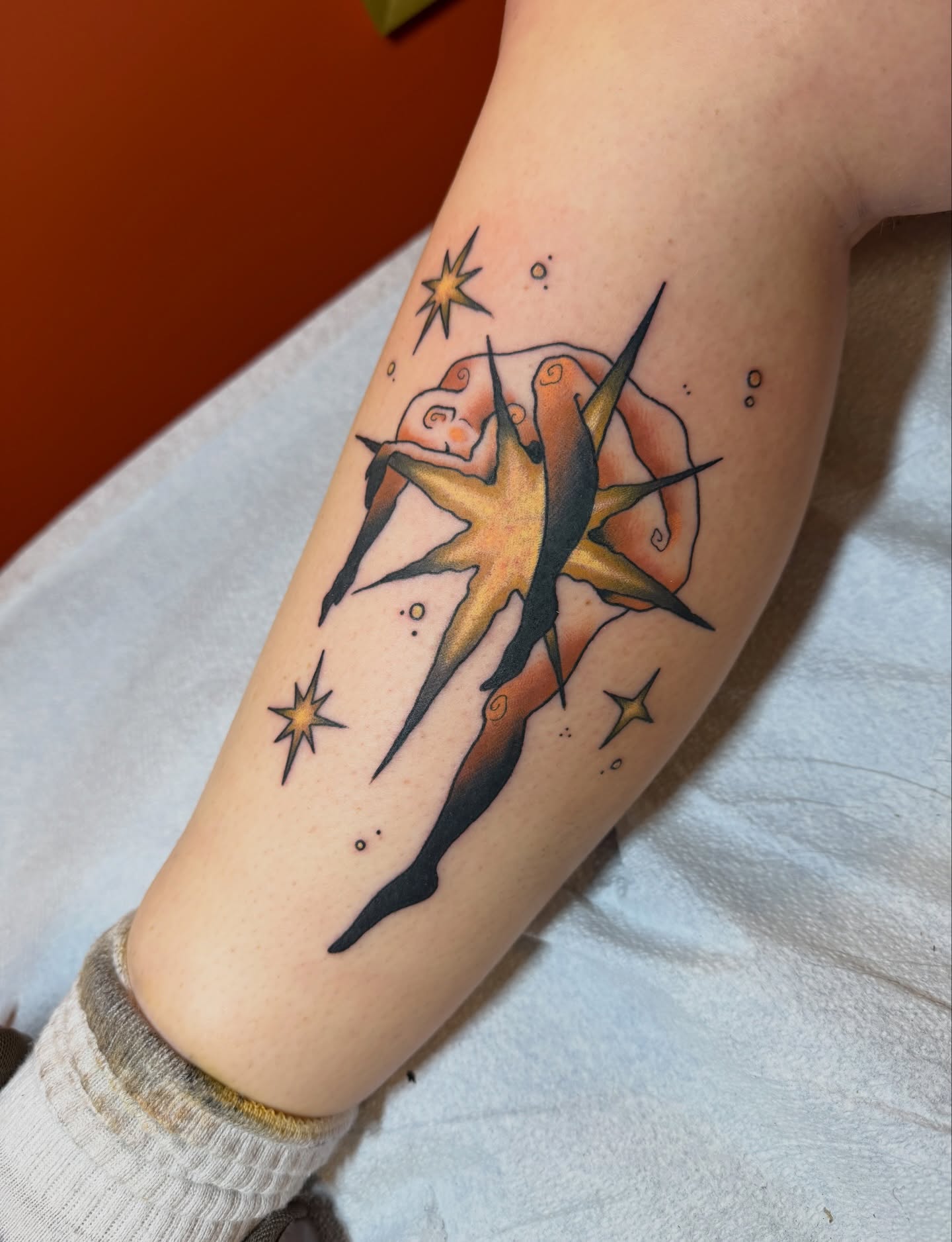 Starburst American traditional tattoo on the forearm by Gianna Calisi