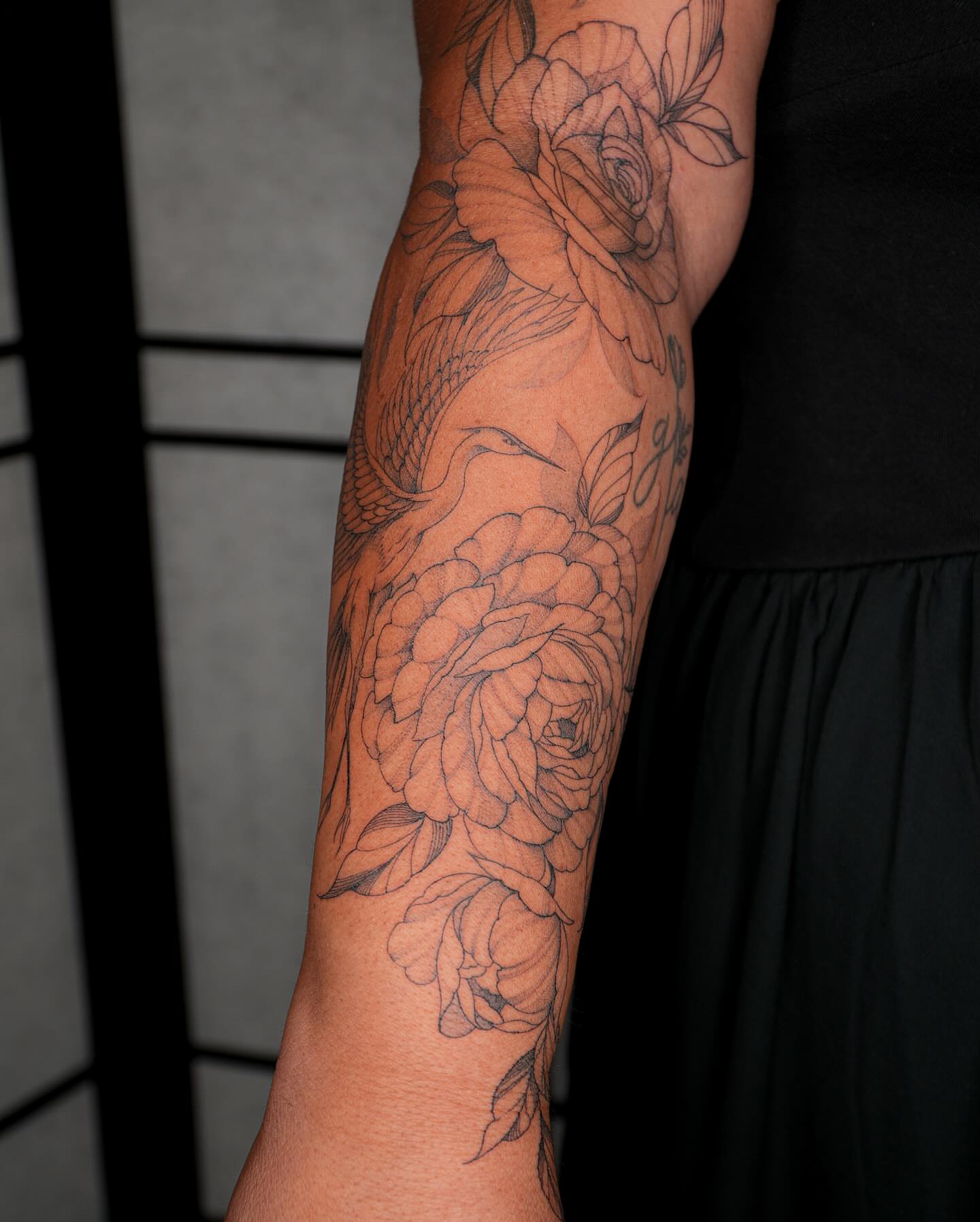 Peonies and bird black and grey tattoo on the forearm by Pandora ✨ Floral, Los Angeles, California