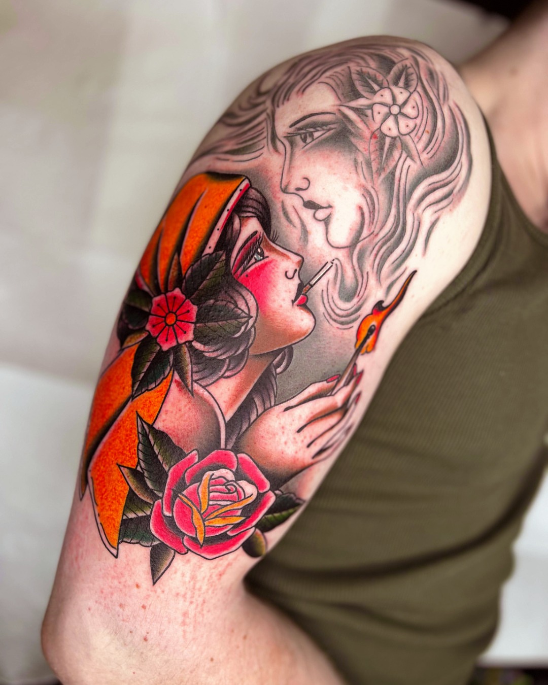 Woman smoking American traditional tattoo on the upper arm by Massimiliano pennella