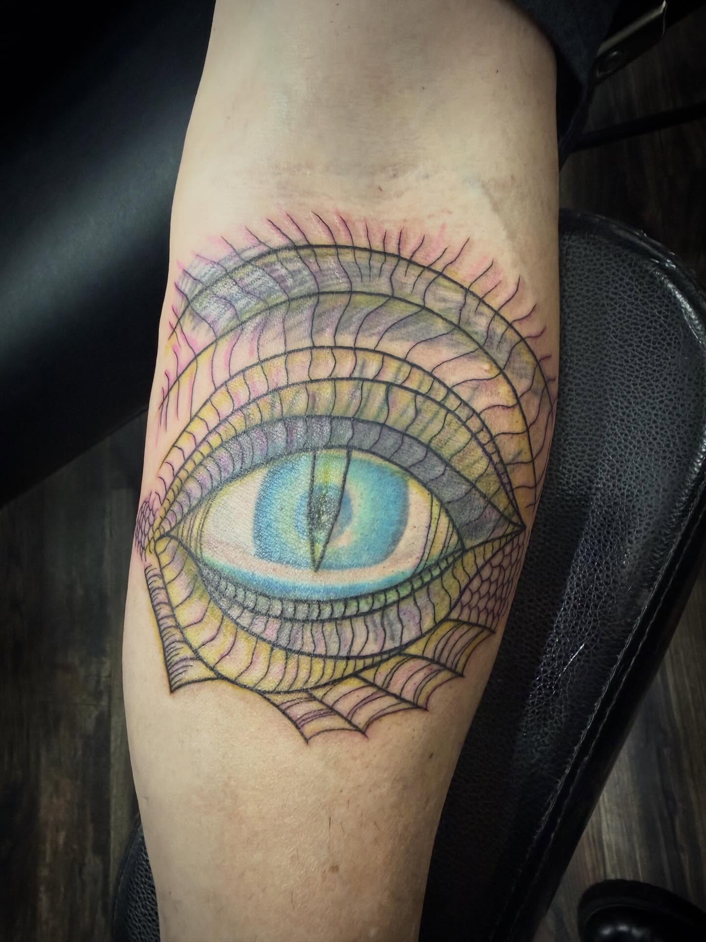 Eye geometric tattoo on the forearm by Abby Hofman