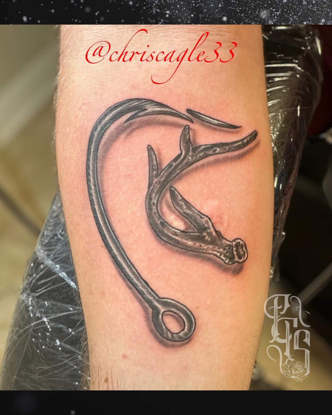 Antler and hook black and grey tattoo on the forearm by Faithful Tattoo Studio