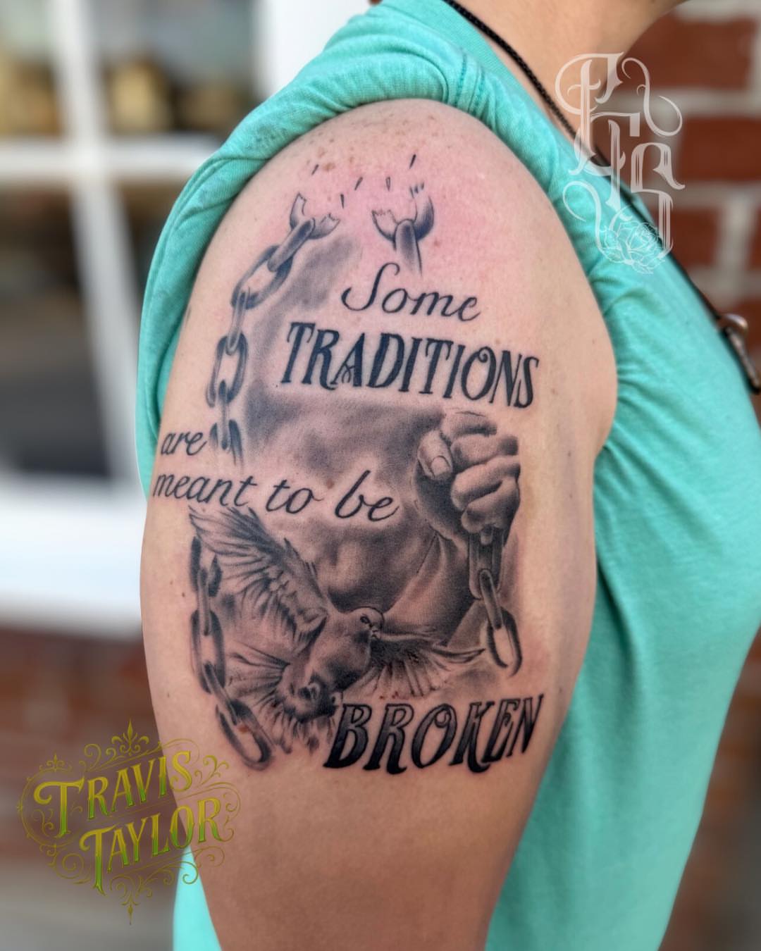 Broken chains black and grey tattoo on the shoulder by Faithful Tattoo Studio