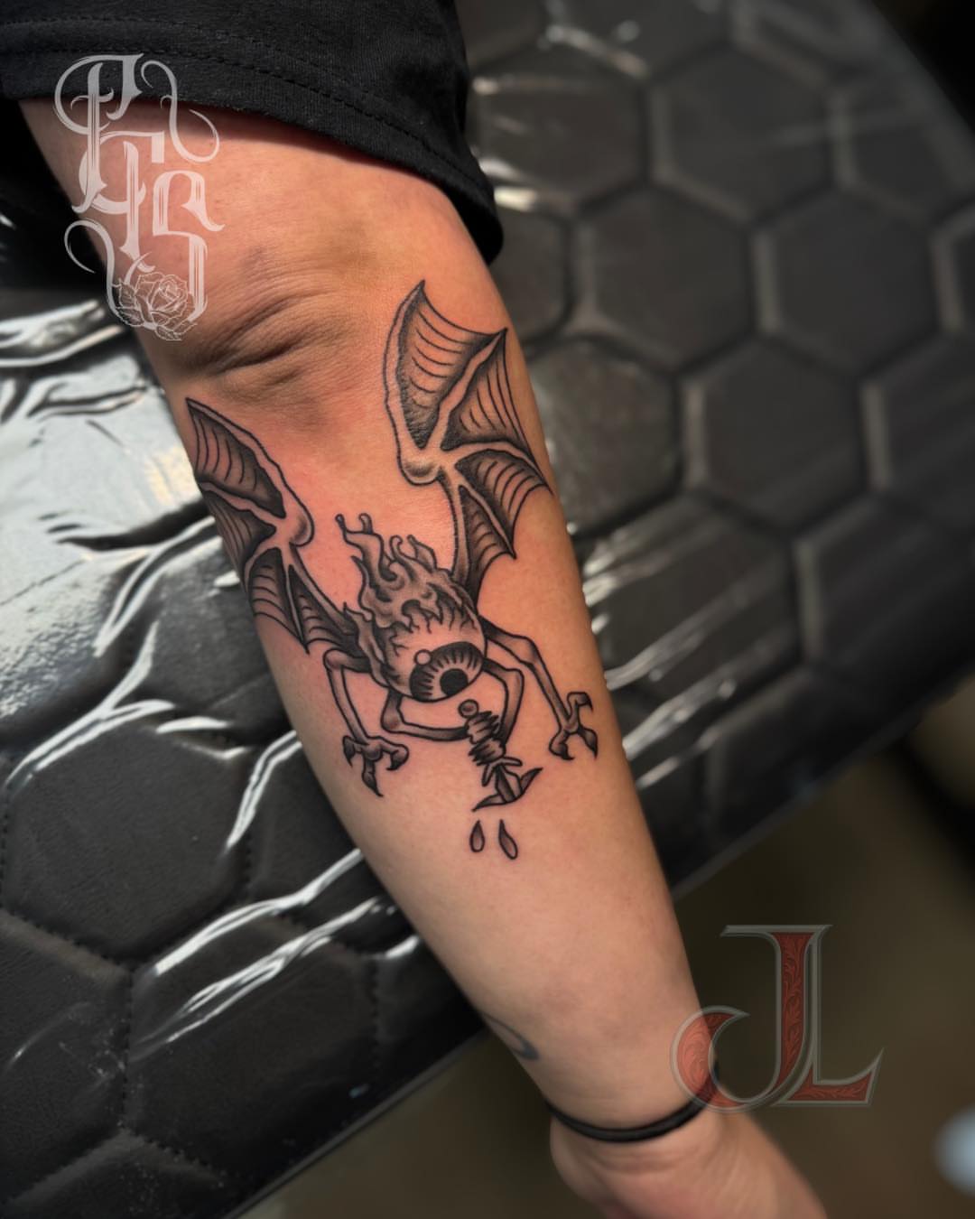 Demon black and grey tattoo on the forearm by Faithful Tattoo Studio
