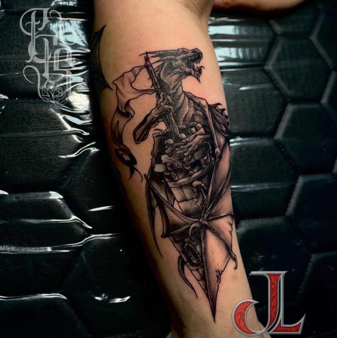 Dragon and knight realism tattoo on the forearm by Faithful Tattoo Studio