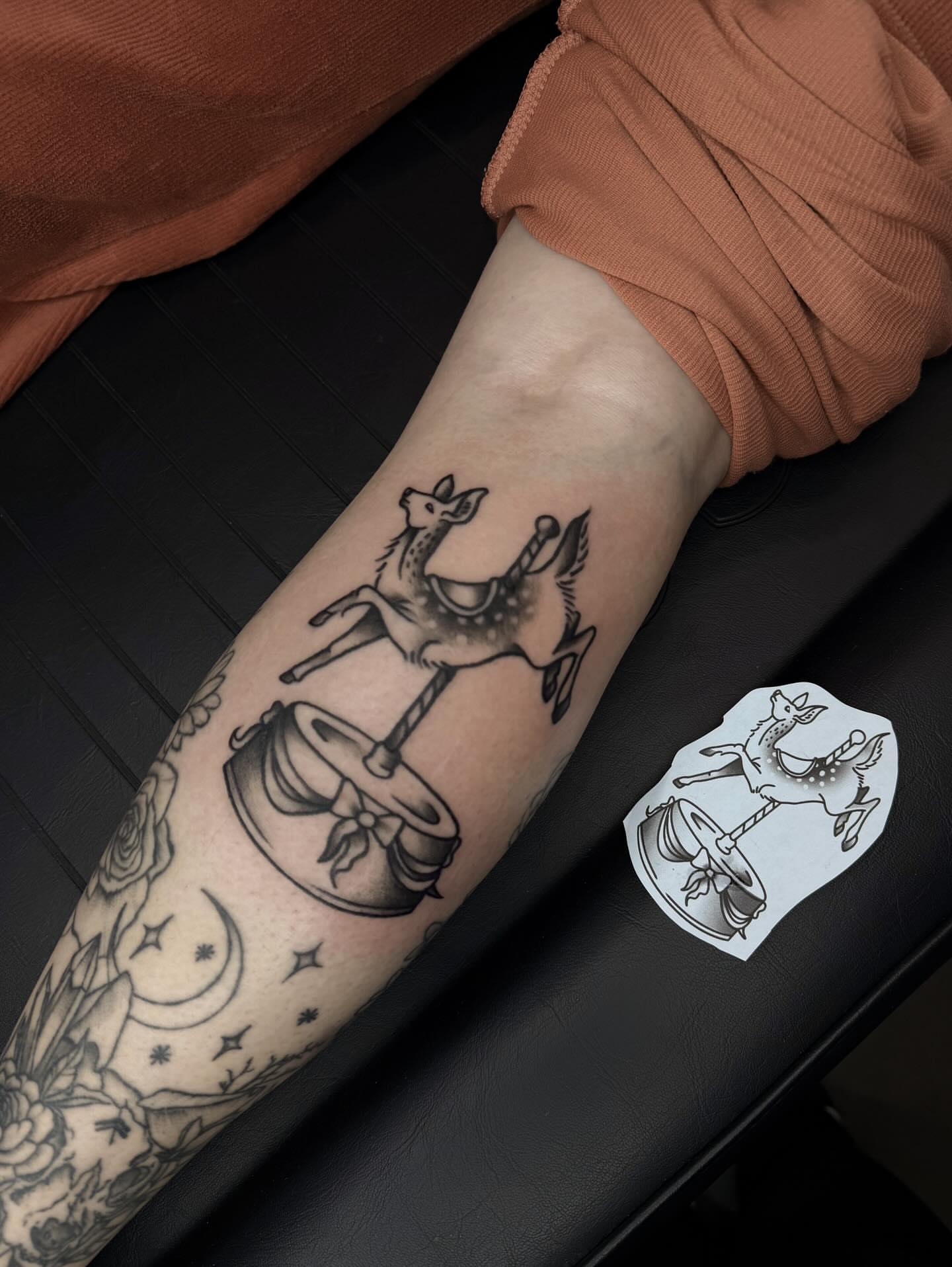 Carousel horse black and grey tattoo on the forearm by Susie Maj