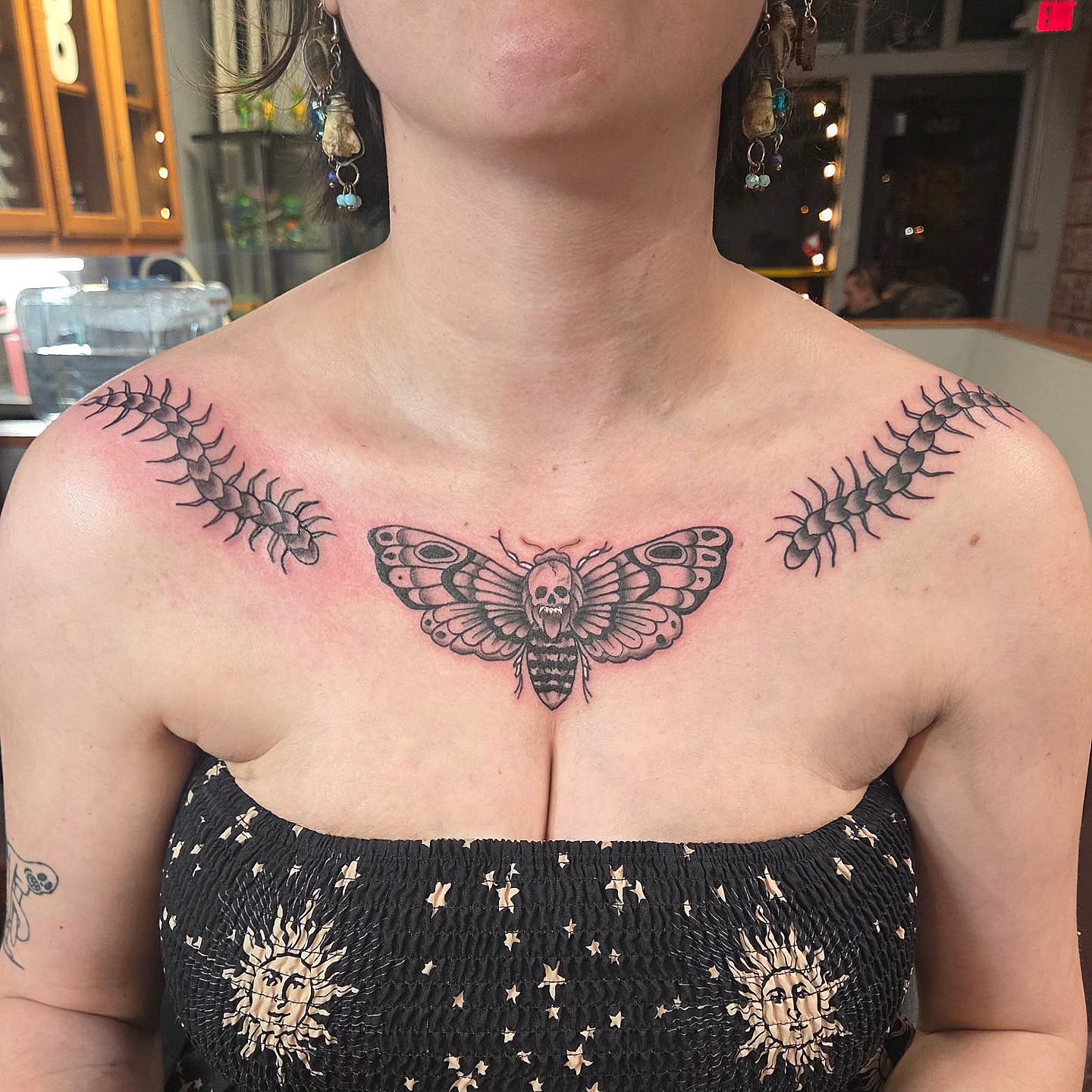 Death moth realism tattoo on the chest by Kat Coniglio Art