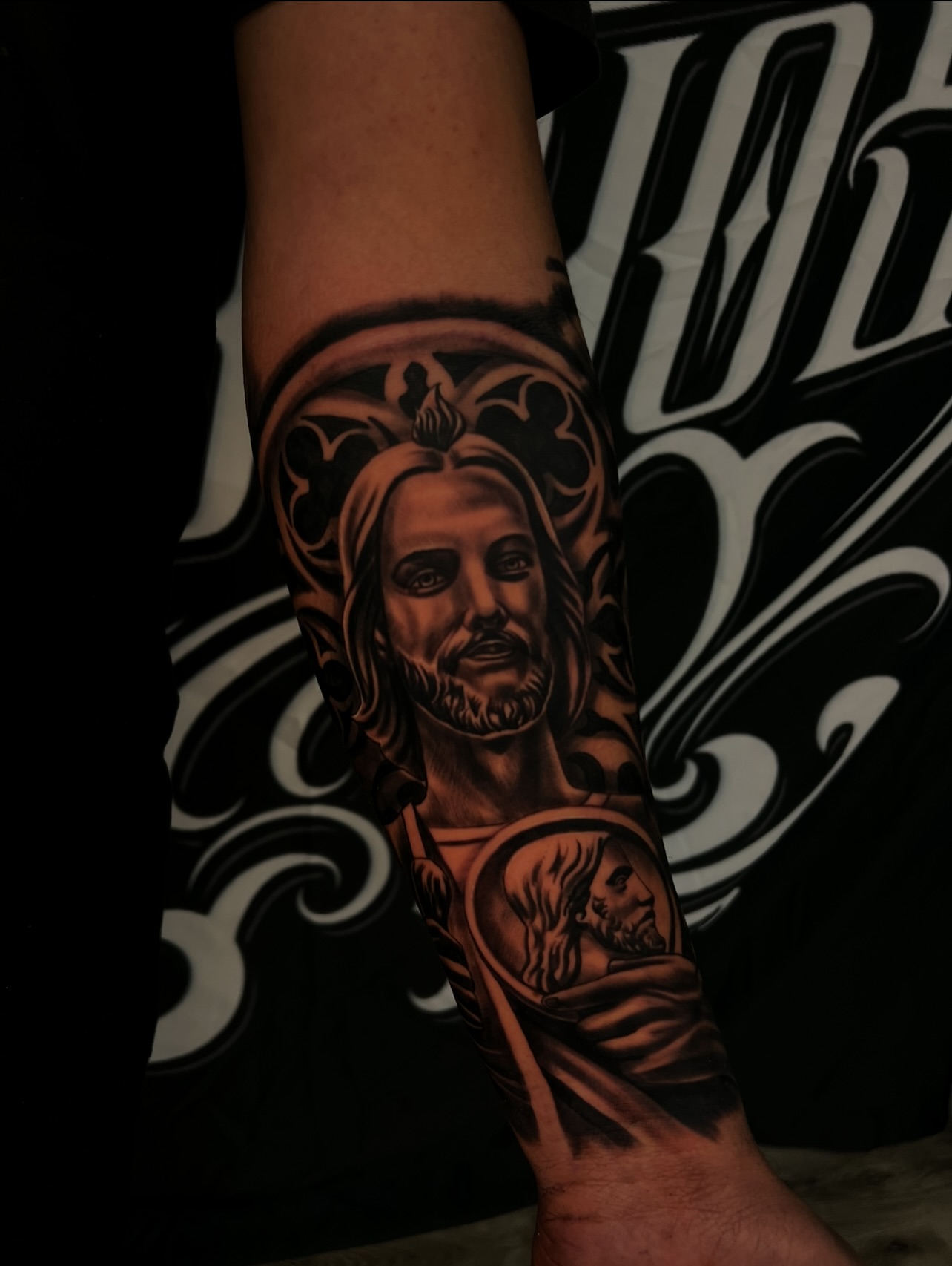 Religious figure black and grey tattoo on the forearm by Daniel Michael Perez