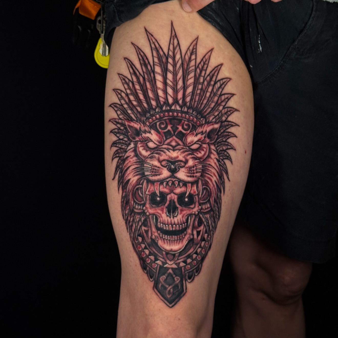 Lion skull American traditional tattoo on the thigh by Gary Chase