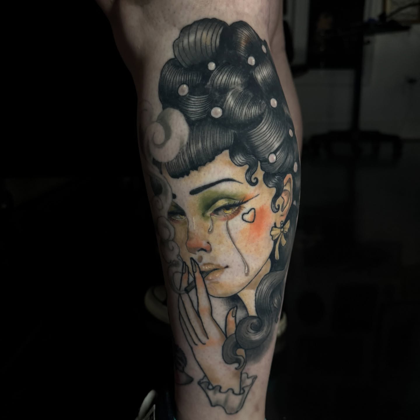 Woman with dramatic expression dotwork tattoo on the forearm by Hannah Mckee
