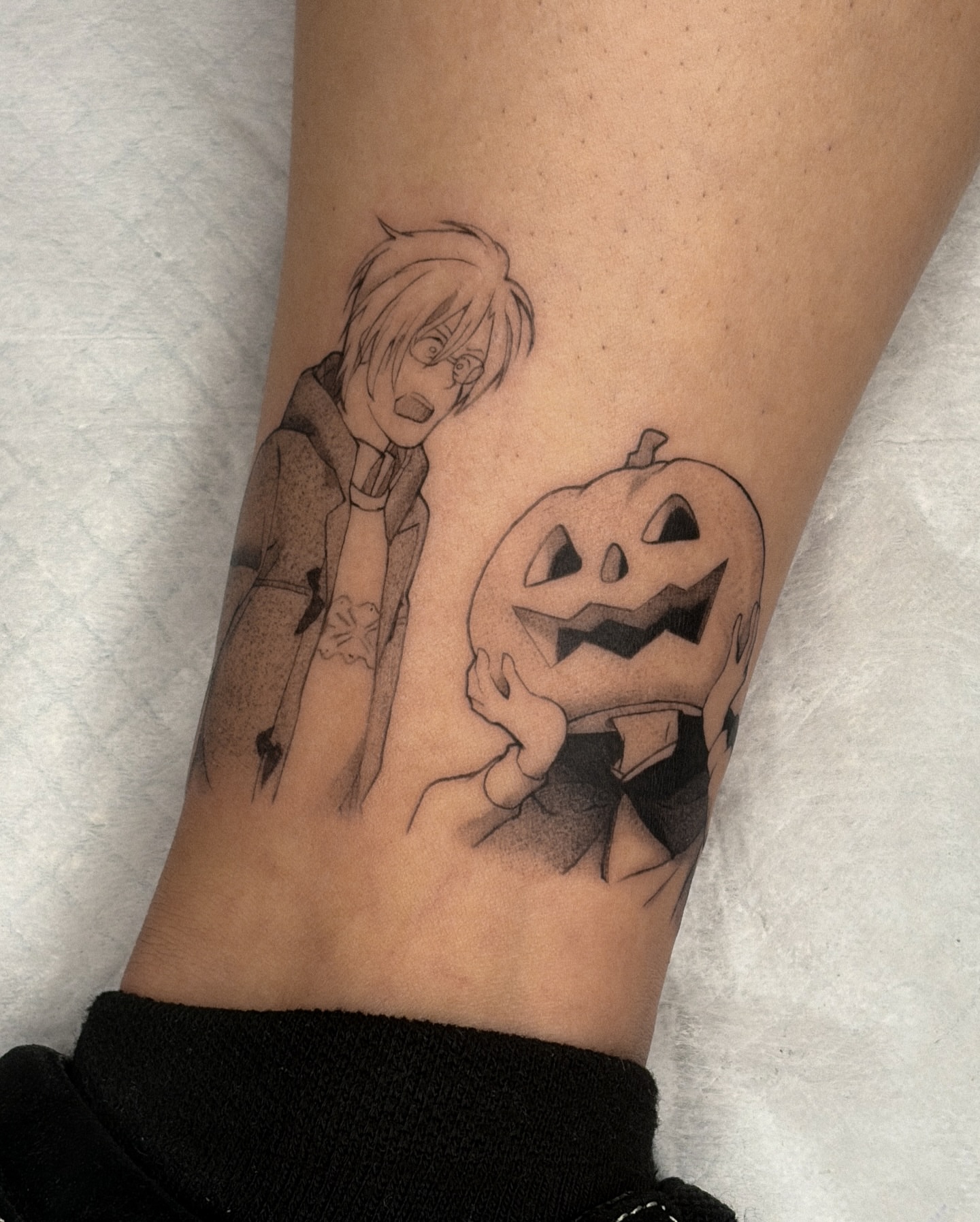Pumpkin and character black and grey tattoo on the forearm by ☆ gia