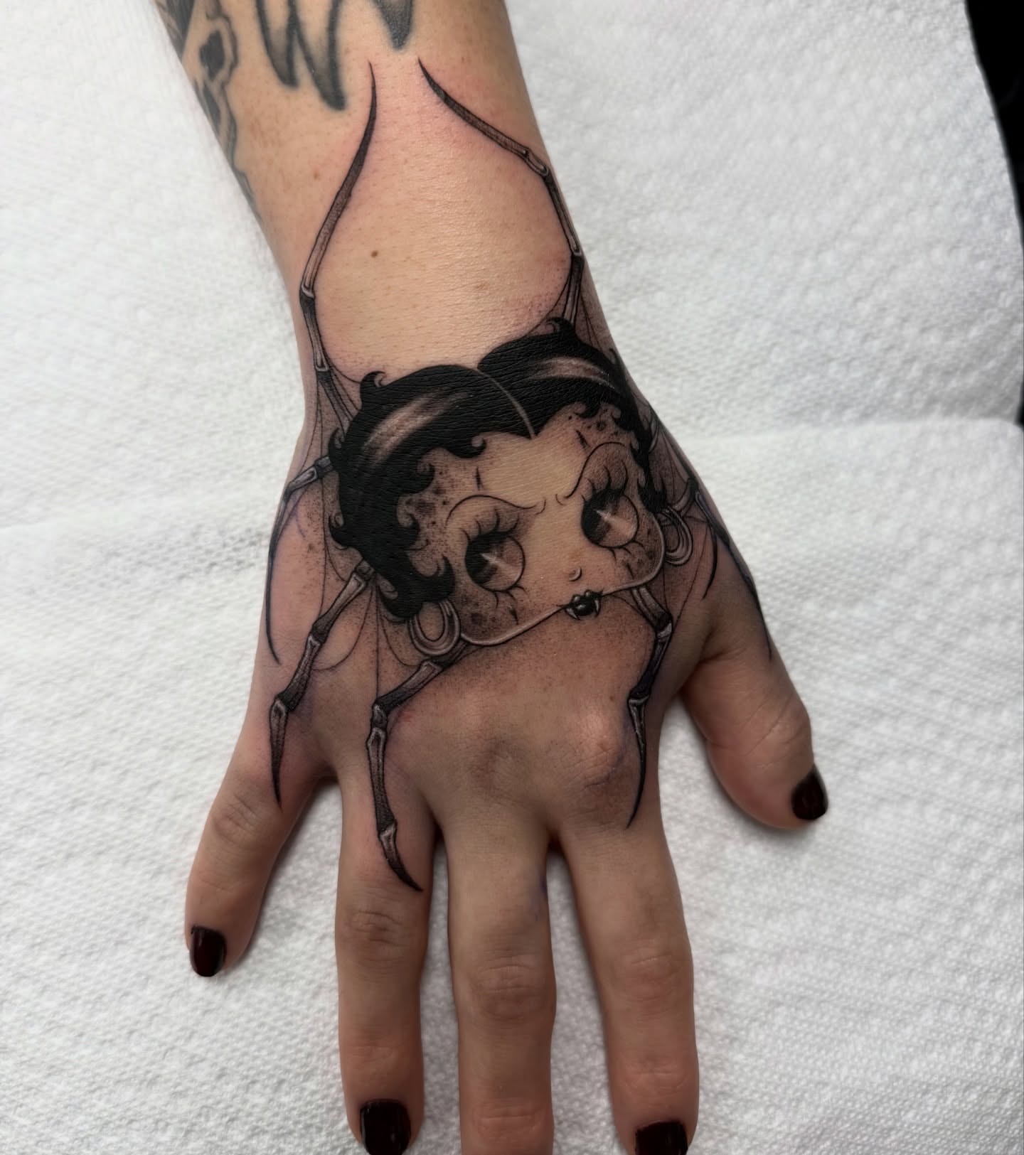 Betty Boop realism tattoo on the hand by dinah