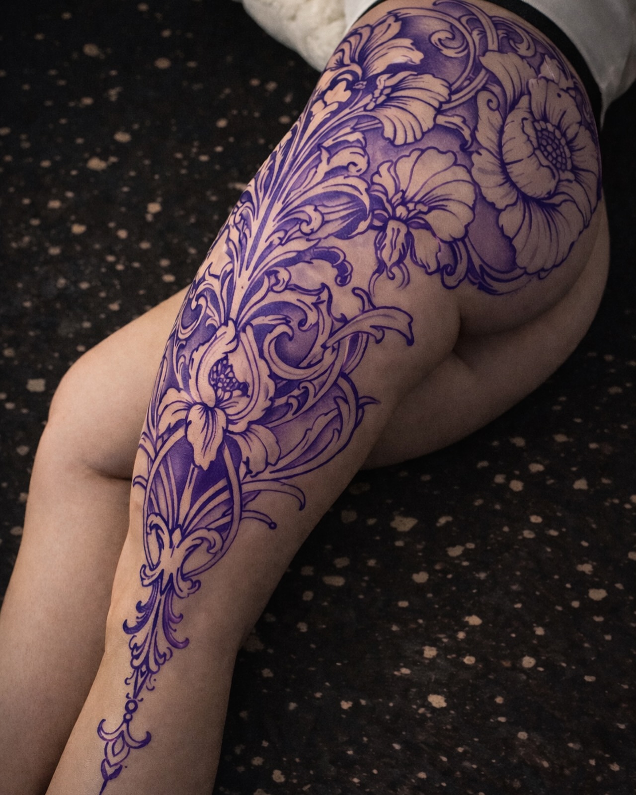 Floral pattern ornamental tattoo on the thigh by David Garner, Los Angeles, California