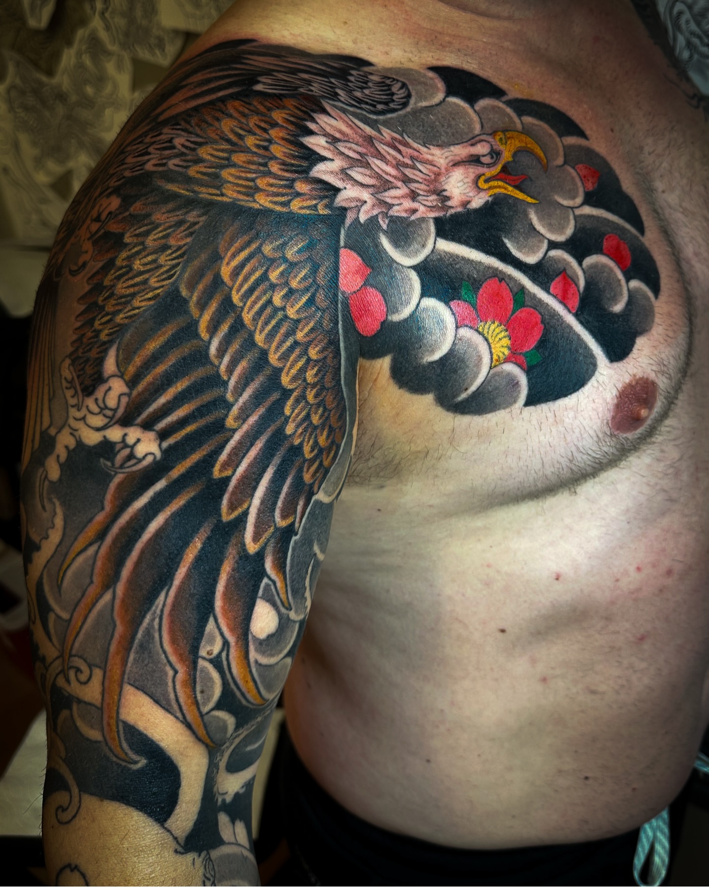 Eagle and cherry blossoms japanese irezumi tattoo on the shoulder by Colin Kenji Baker, San Jose, California
