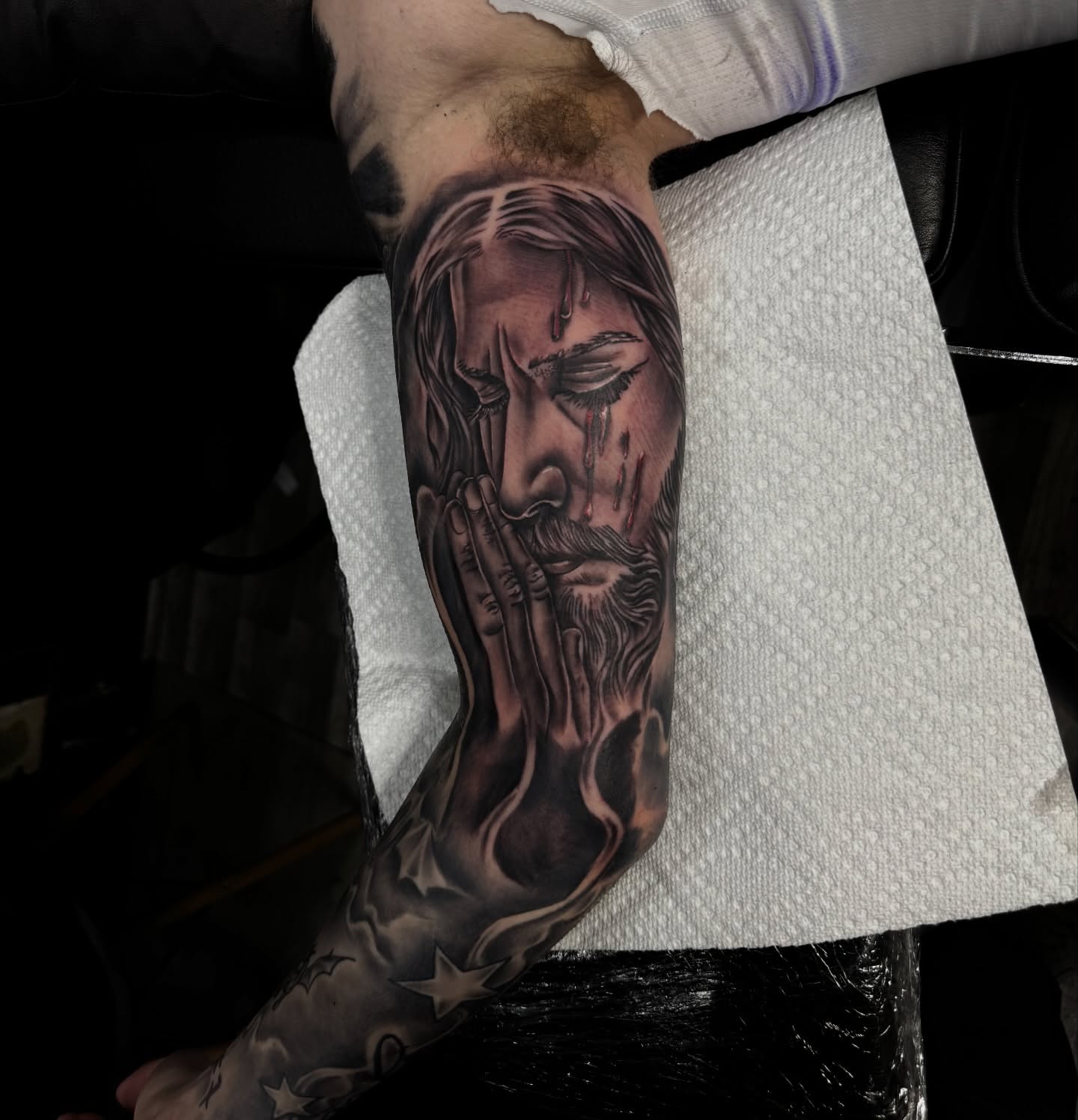 Religious figure realism tattoo on the forearm by Zeus