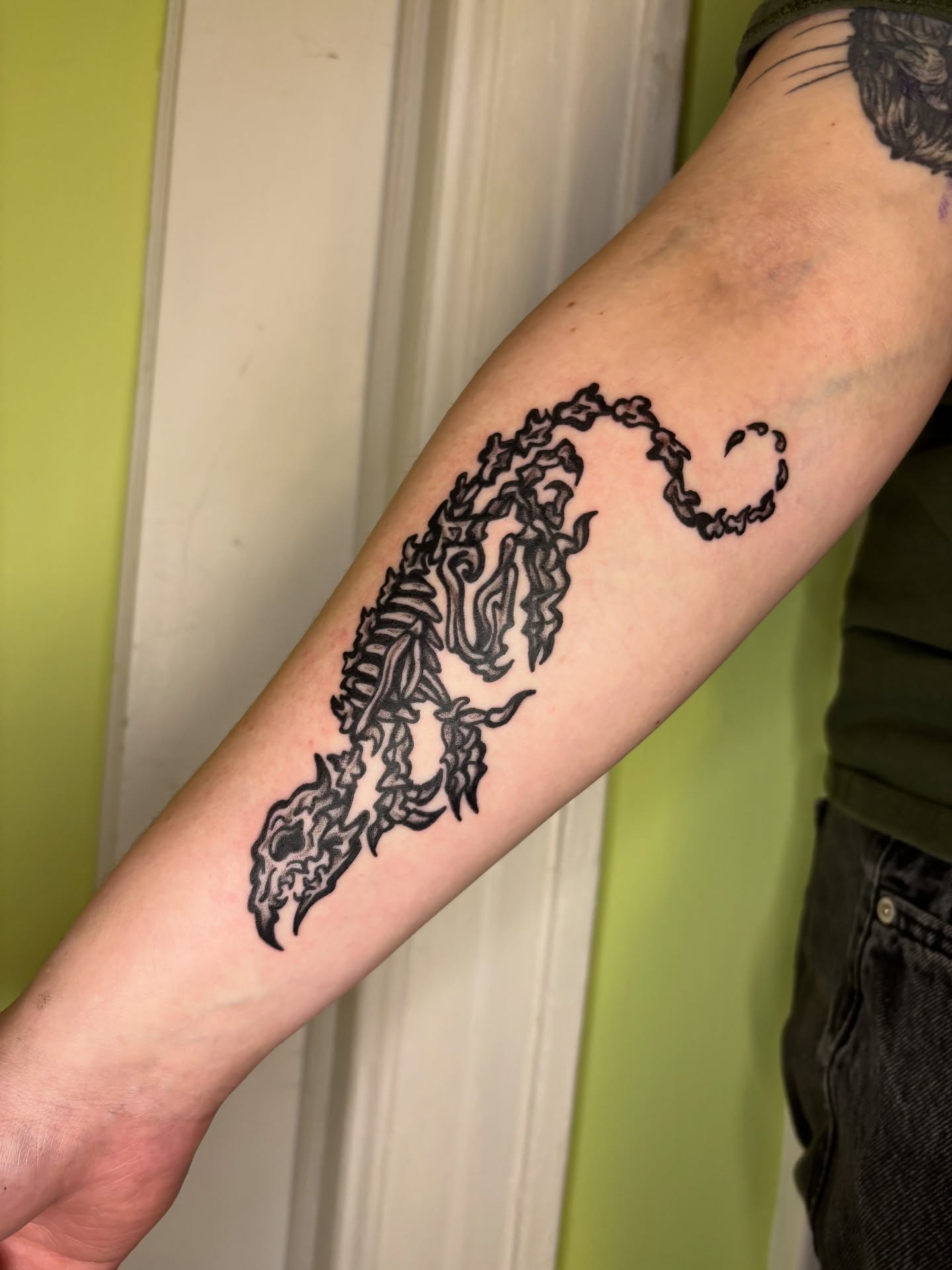 Scorpion black and grey tattoo on the forearm by Grae