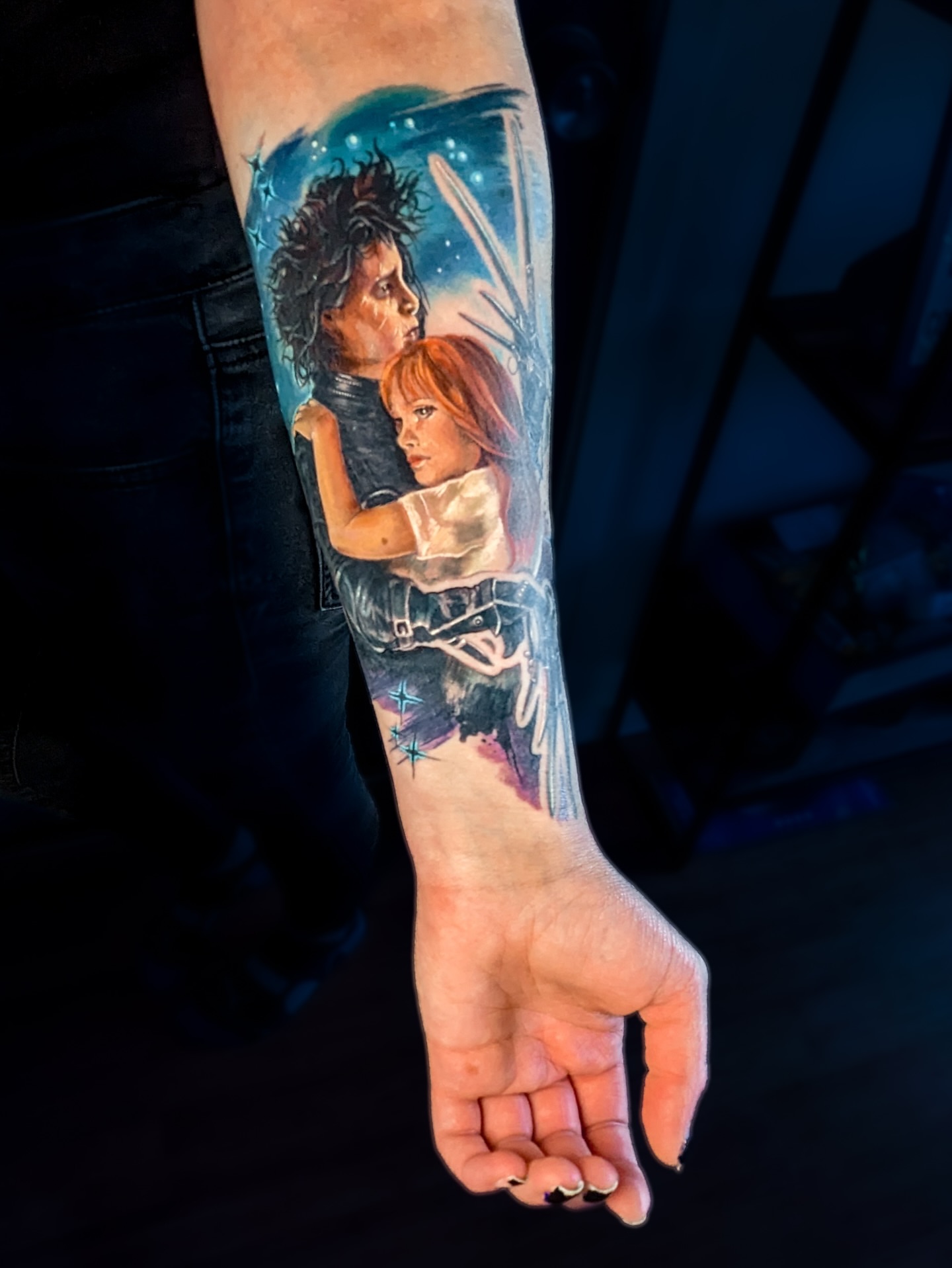 Edward Scissorhands and Winifred realism tattoo on the forearm by Amy Zager