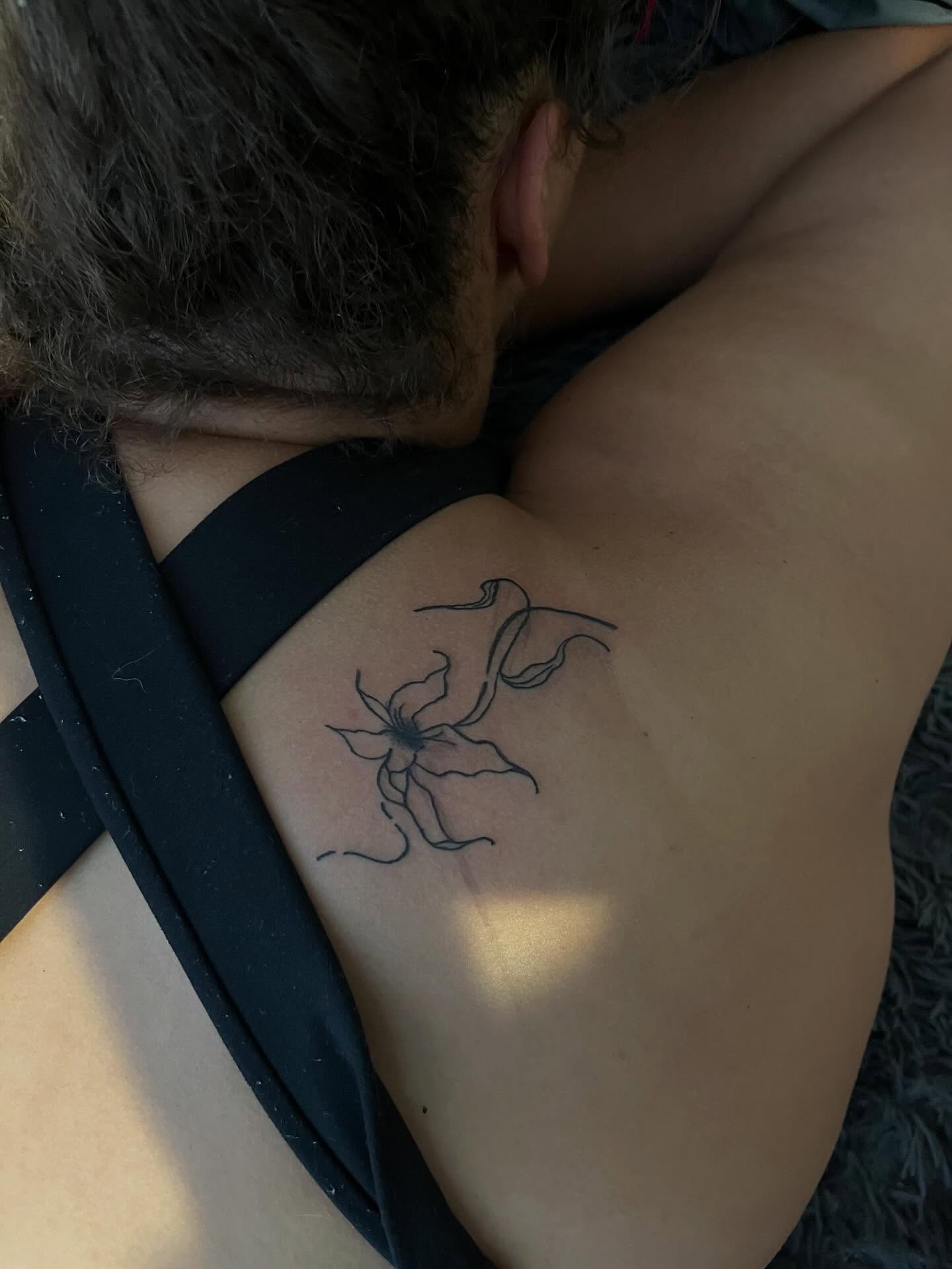 Flower fine line tattoo on the shoulder by XoXandrea.Ink, Kansas City, Missouri