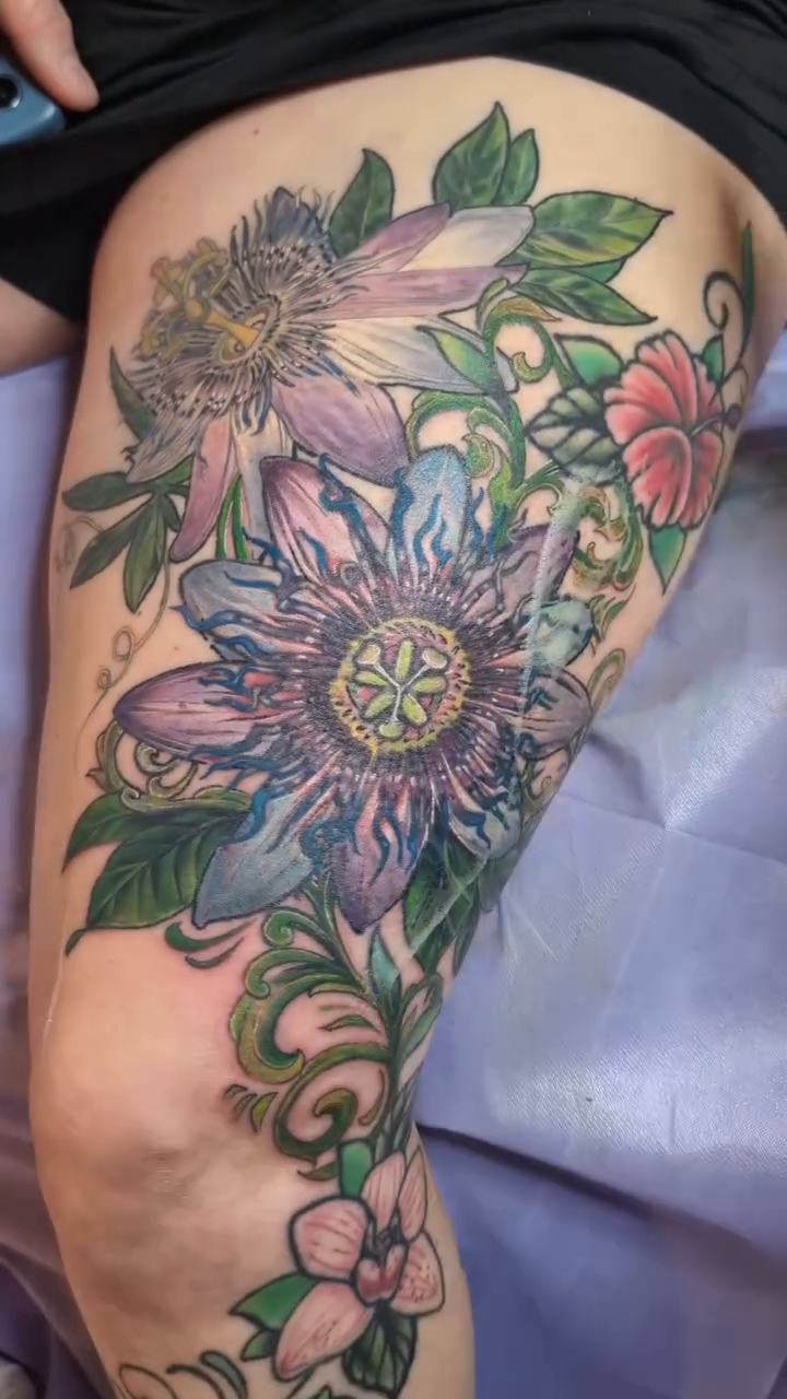 Passion flower and other flowers neo-traditional tattoo by Ashton Allen-Ruiz, Portland, Oregon