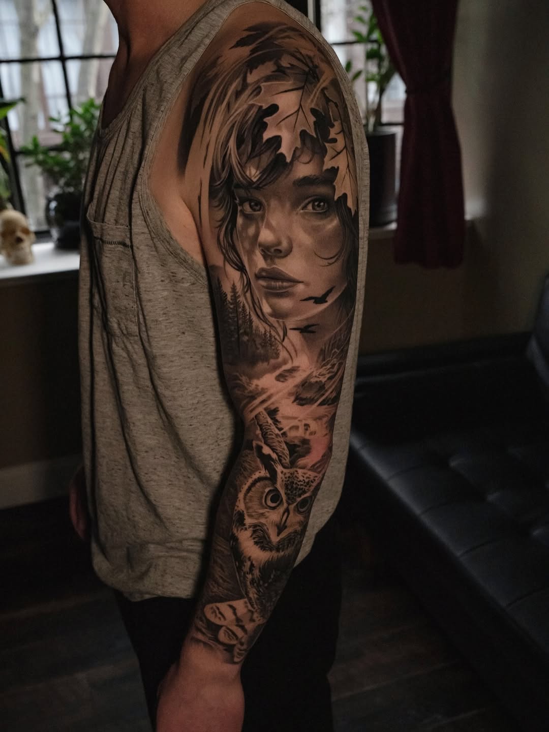 Woman portrait with owl and forest realism tattoo on the forearm by @kotytattoos