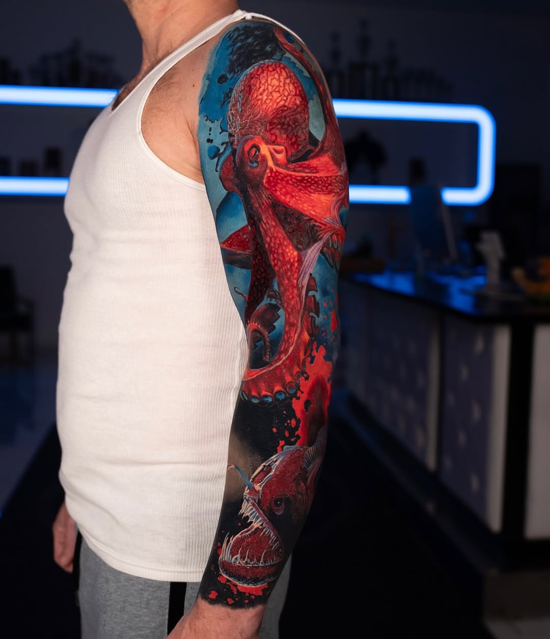 Octopus and anglerfish biomech tattoo on the upper arm by B R A D C H A R L e S