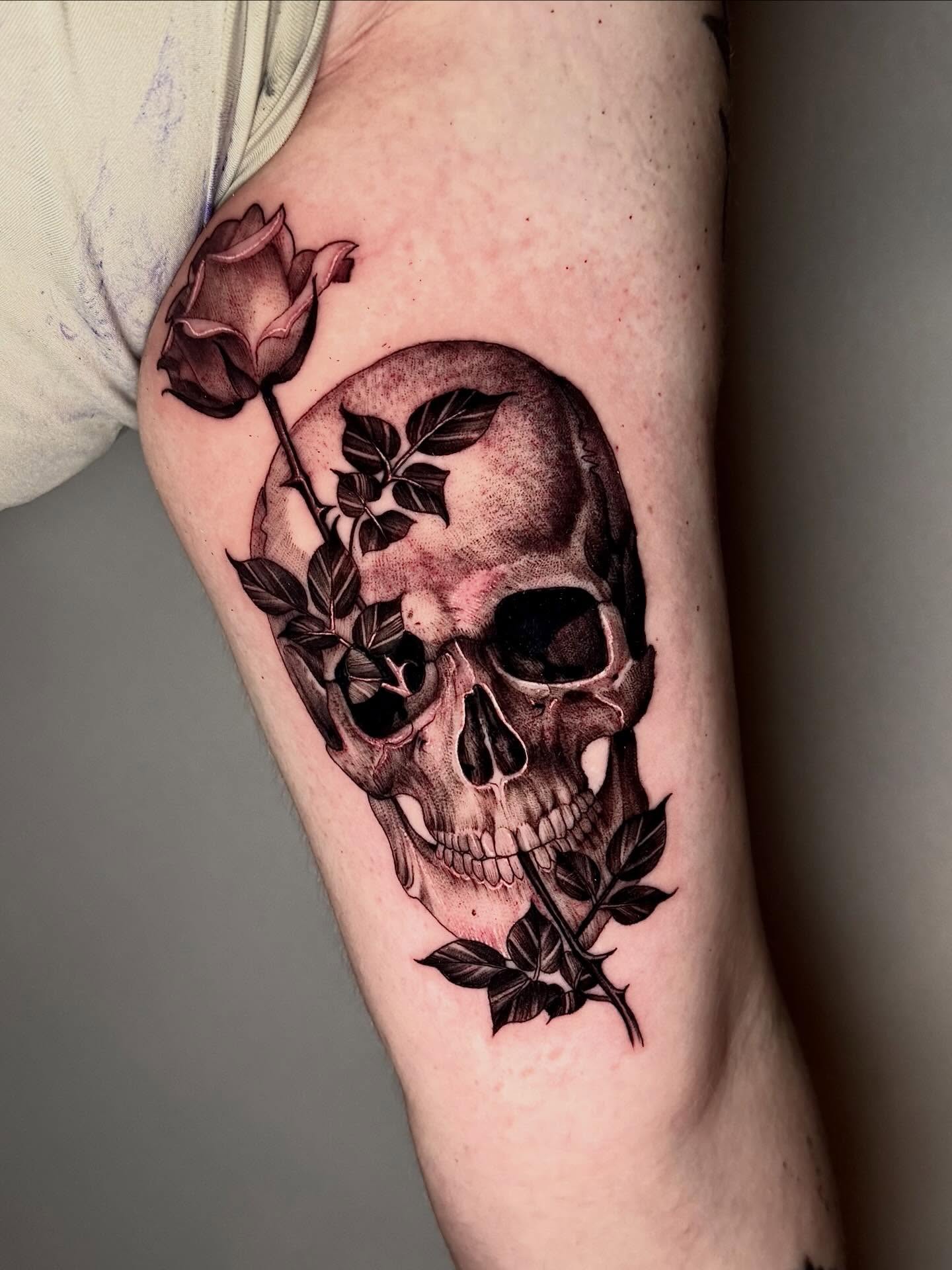 Skull and roses realism tattoo on the forearm by Joi Bailey, Denton, Texas